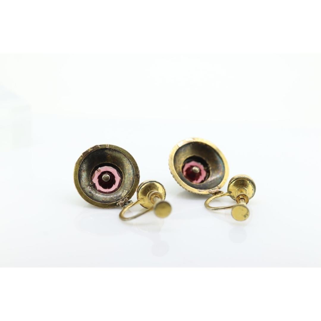 Vintage from the 19th century
Materials: Stone
Gemstone: Garnet
Location: Earlobe
Closure: Screw back

Style: Mid-century


Antique Victorian Etruscan Revival Earrings.

14k Yellow Gold Lower part with Garnets and Pearls. The Screw Back is Gold