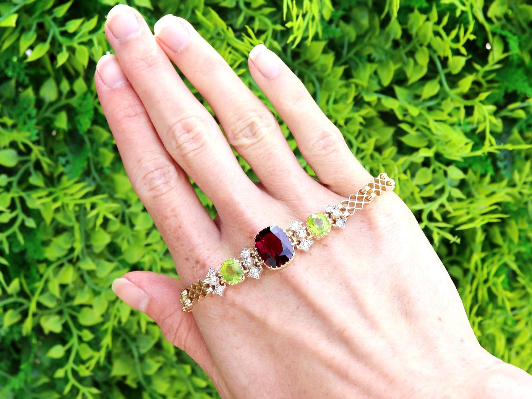 A stunning, fine and impressive antique 5.17 carat garnet, 3.10 carat peridot and 0.49 carat diamond, 15 karat yellow gold and silver set bracelet; part of our collection of antique bracelets.

This stunning antique bracelet has been crafted in 15k