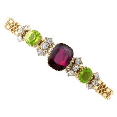 Antique Garnet, Peridot and Diamond, 15 Karat Yellow Gold Bracelet Circa 1910