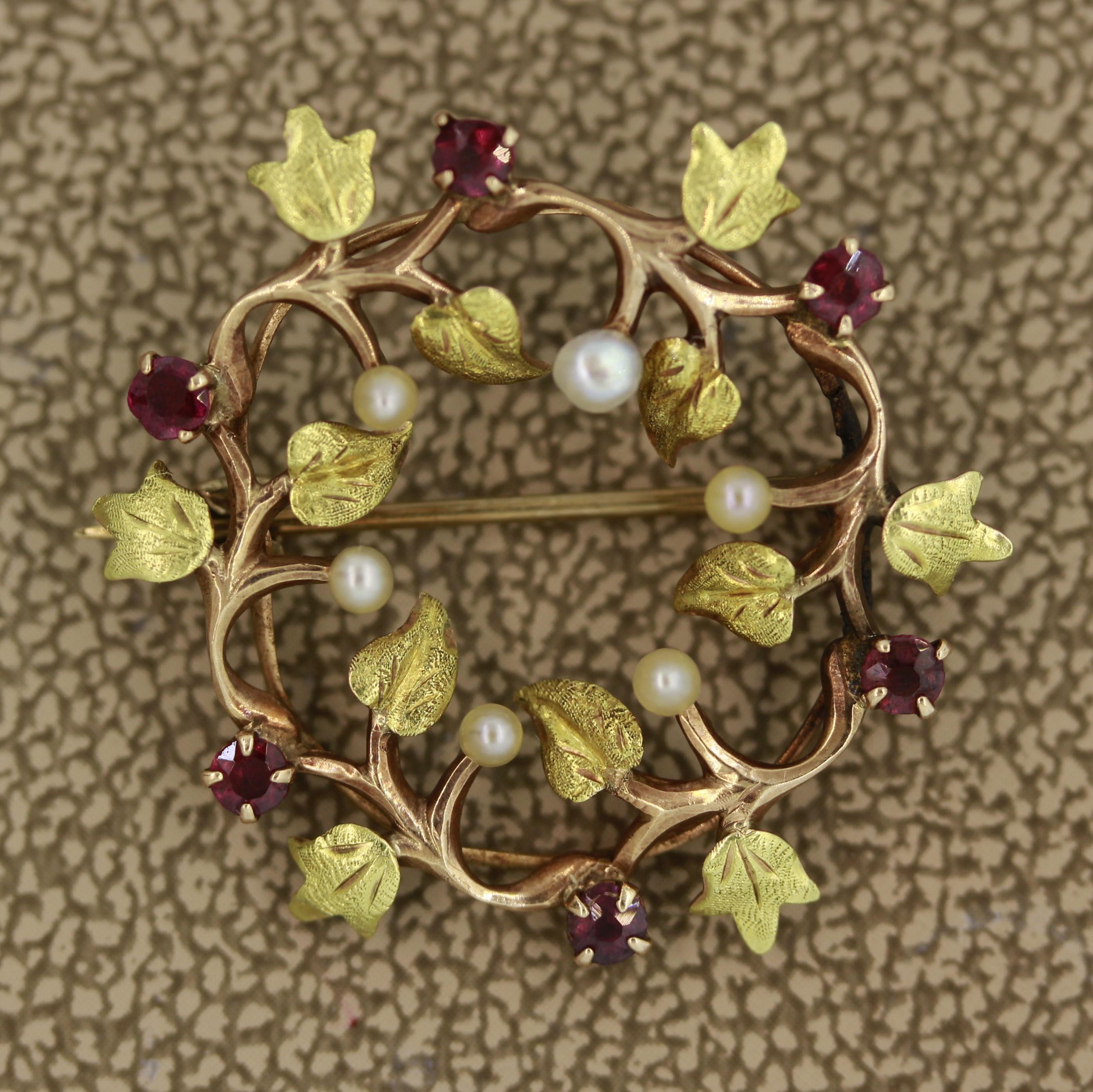 A small and detailed pin of autumn foliage. Hand made in 14k gold this piece features 6 round cut red garnets and 6 natural seed pearls.

Length: 1 inch