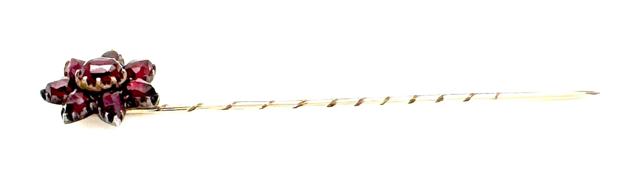 This wonderful little garnet star stick pin was had crafted in the last quarter of the nineteenth century. The star is made up from bright red facetted bohemian garnets. The star is made up from seven pointed garnet an a larger oval stone in its