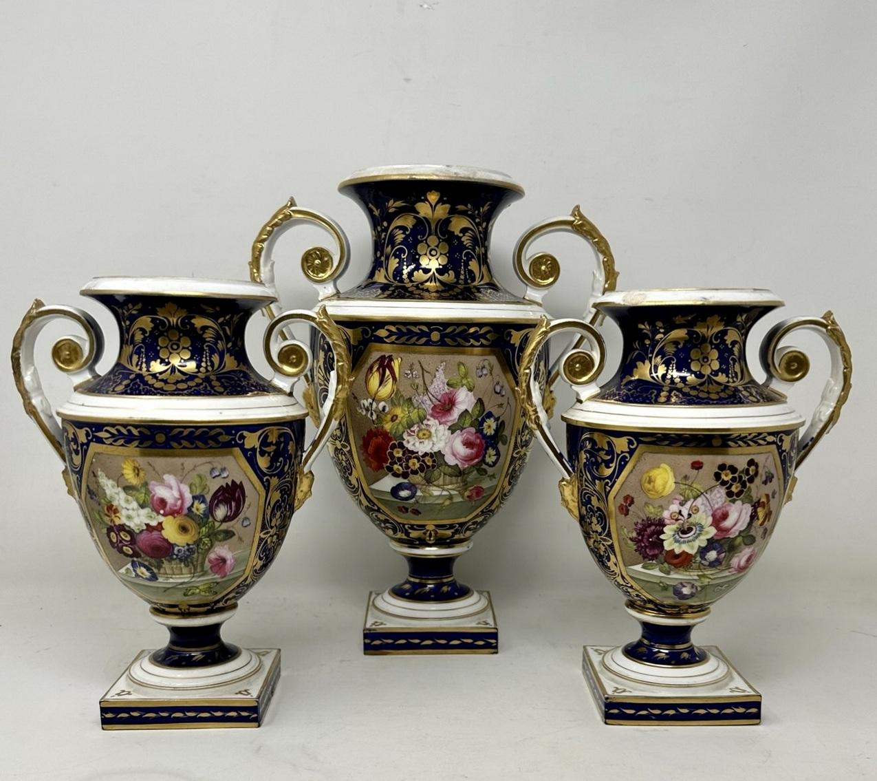An exceptionally fine quality rare example of an early Bloor period Royal Crown Derby hand painted porcelain Garniture of generous proportions by Thomas Steel. First quarter of the Nineteenth Century, Regency period. 
Each vase finely painted on the