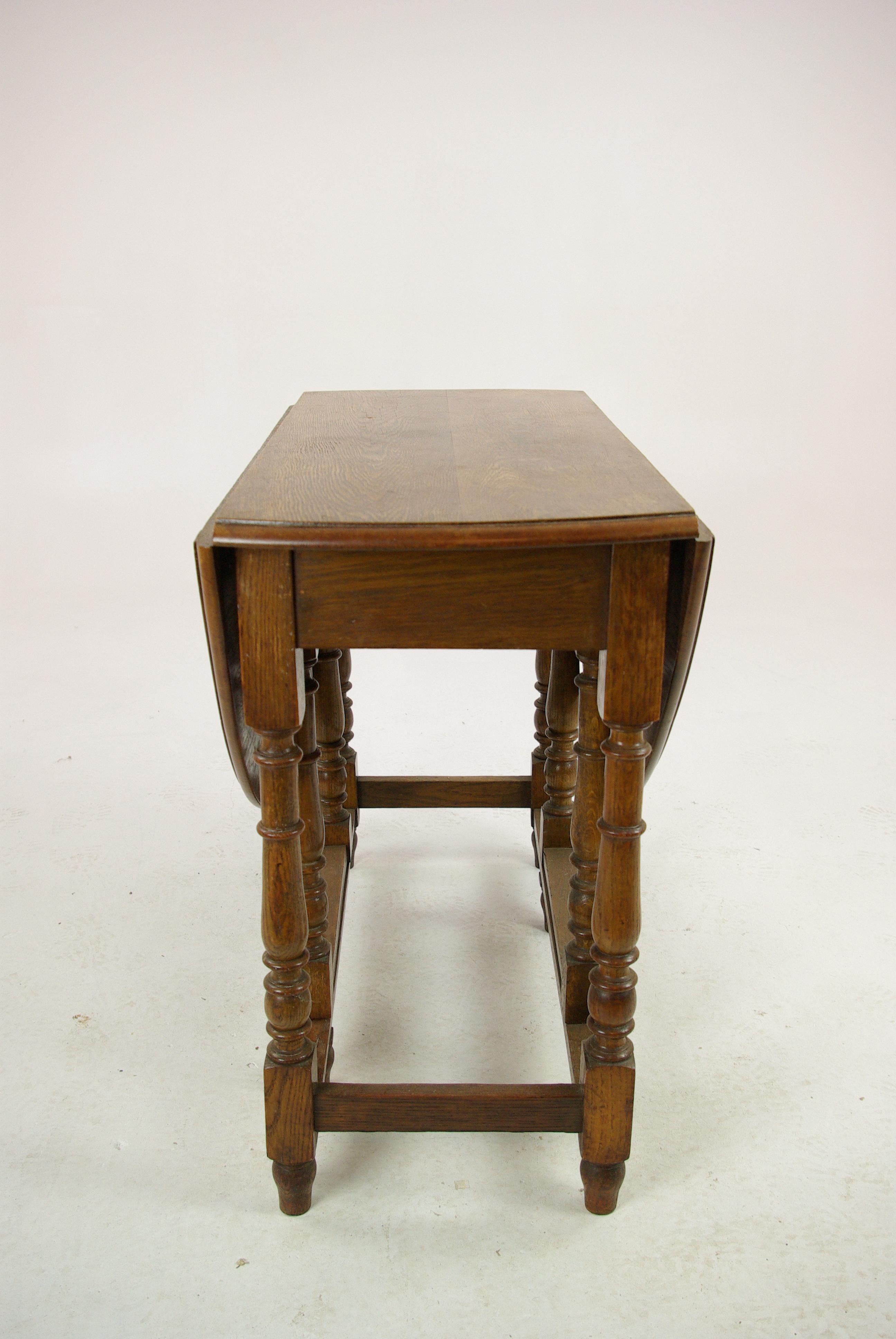 Antique gateleg table:: oak oval drop leaf table:: Scotland 1920s:: antique furniture:: B1419

Scotland:: 1920s
Solid oak construction
Original finish
Two oval drop leaves to the side
Ending on thick turned legs
Joined by cross stitches
Very clean