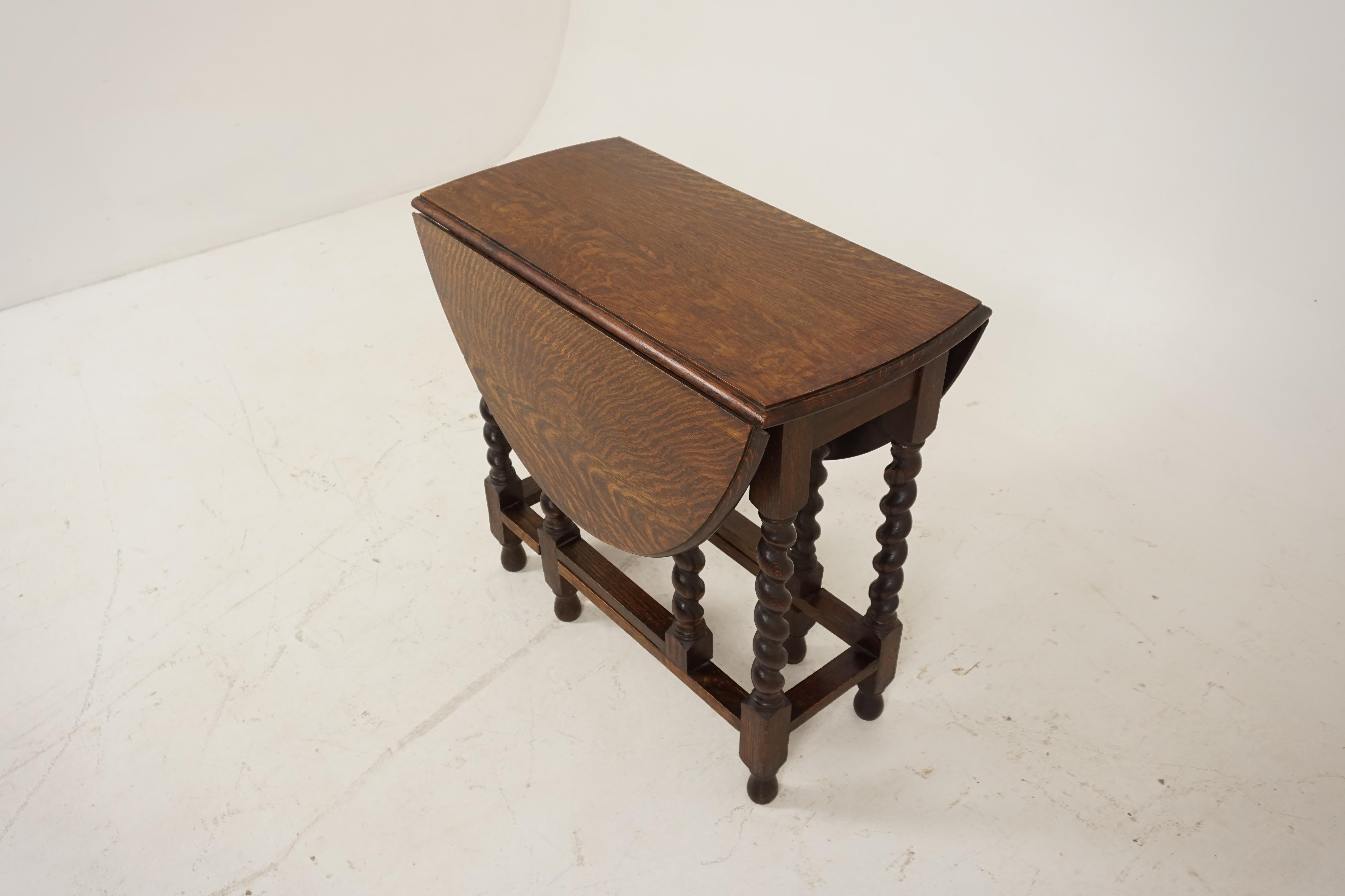 Antique gateleg table, tiger oak, barley twist, drop leaf table, Scotland, 1920

Scotland, 1920
Solid tiger oak construction
Original finish
Moulded rectangular top
Two oval drop leaves to the sides
Ending on thick barley twist