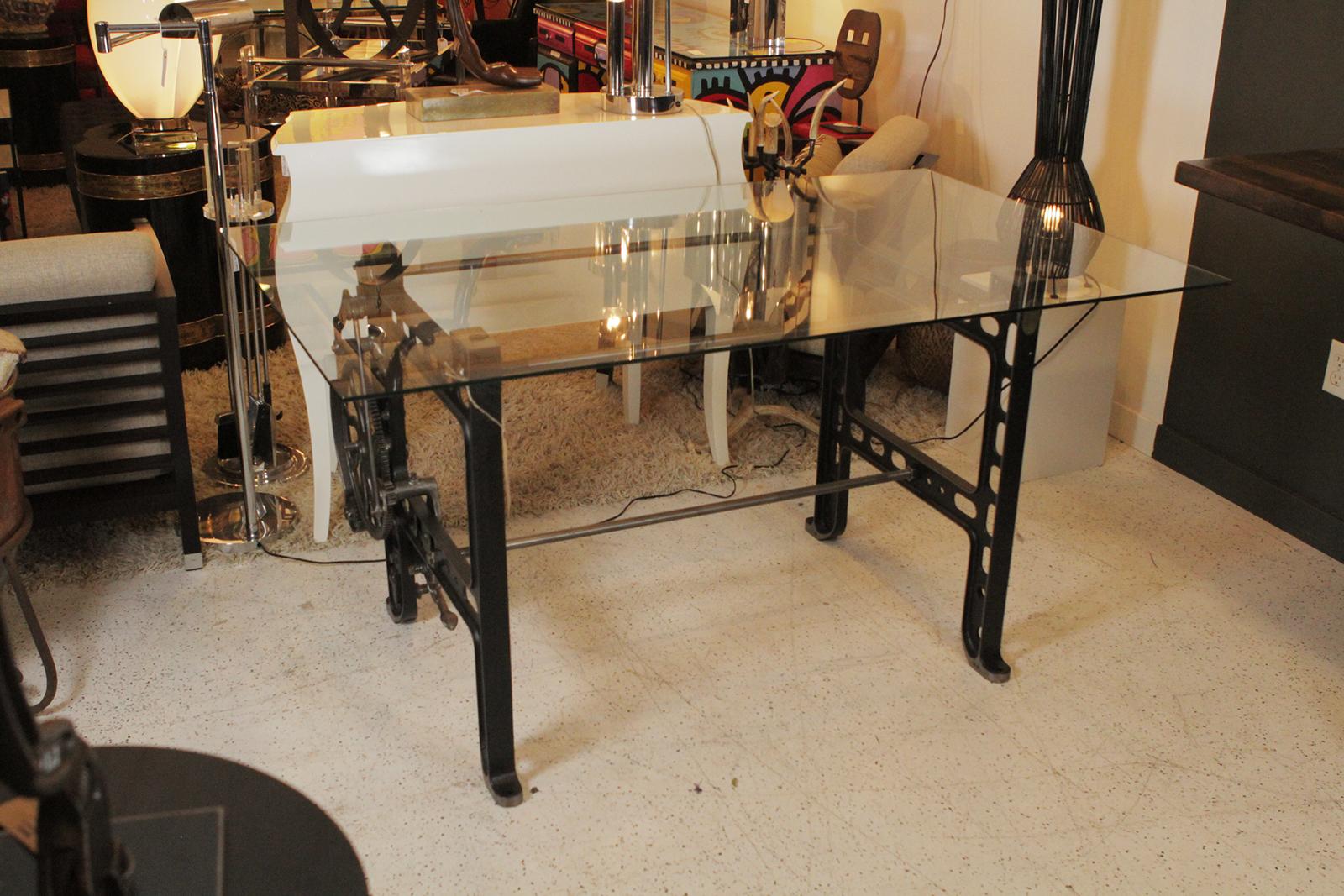 Antique gear base redesigned now as a glass top table, was a work station in a knitting mill
Dimensions: 36” D X 59” W X 29.5” H.