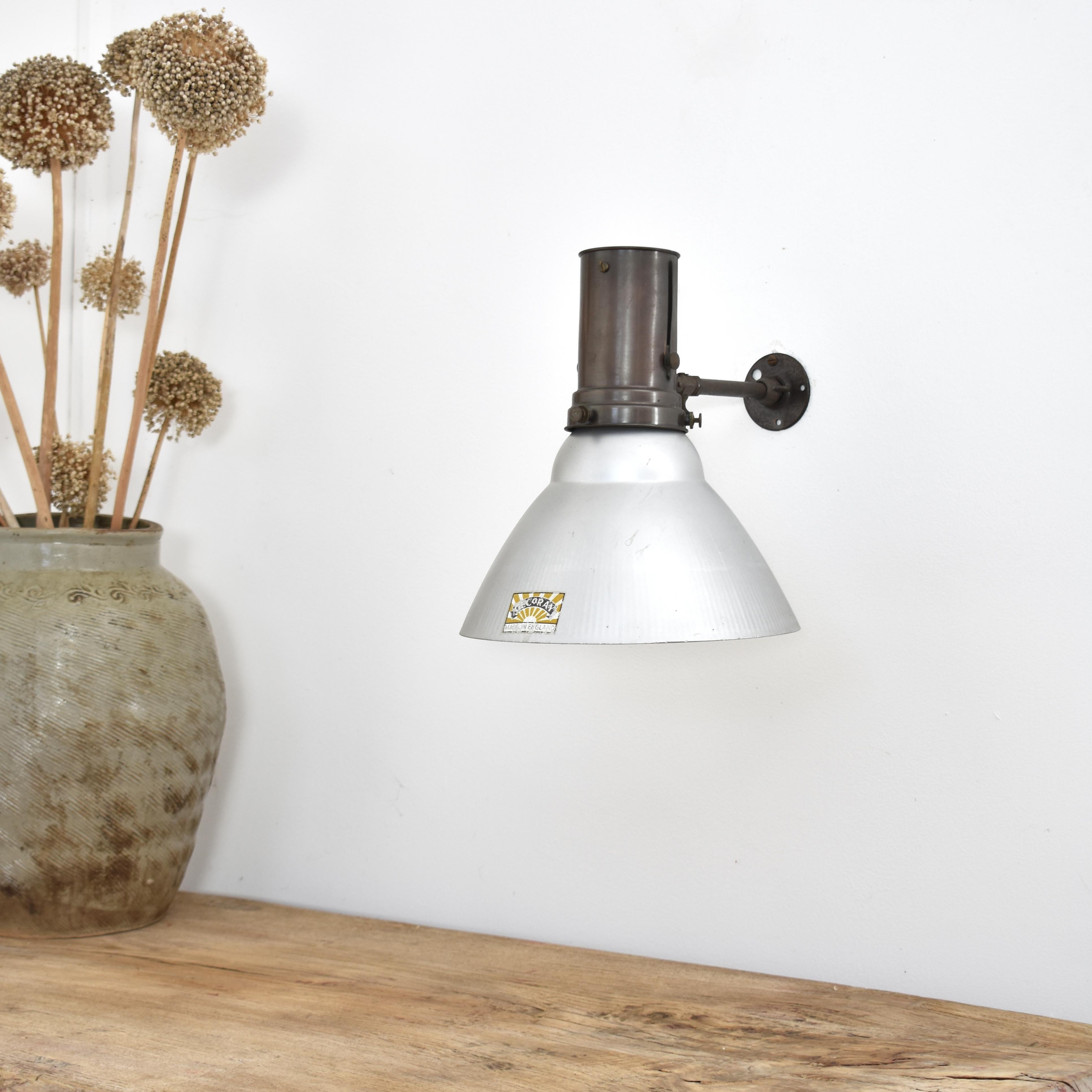 Antique GECoRay Wall Light- H

An early silver backed glass wall light by British manufacturer ‘GEC’ entitled the ‘GECoRAY’.The copper and brass metal wall fitting has been left in its original condition with years of patina. The glass shade left in