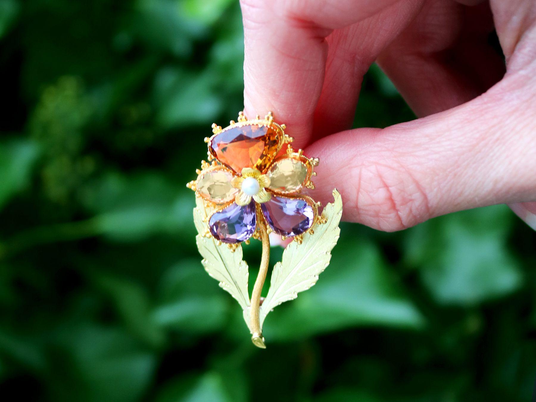 A stunning, fine and impressive antique 2.26 carat smoky quartz, 3.95 carat amethyst, pearl and citrine, 18 karat and 12 karat yellow gold brooch in the form of a pansy; part of our diverse antique jewelry and estate jewelry collections

This