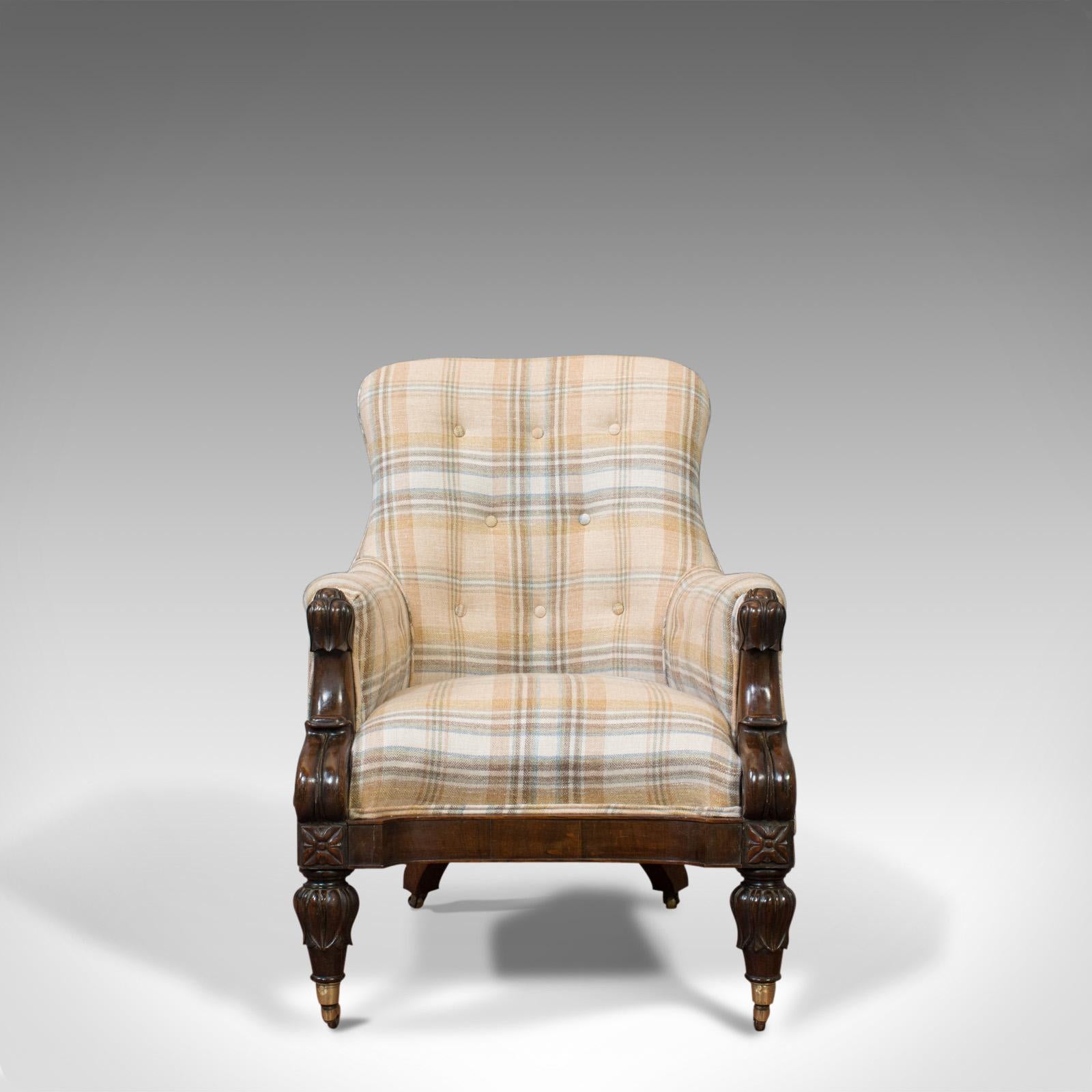 This is an antique gentleman's armchair. An English, rosewood fireside club chair dating to the William IV period of the early 19th century, circa 1835.

Of impressive form and of fine quality
Beautifully carved rosewood displays grain interest