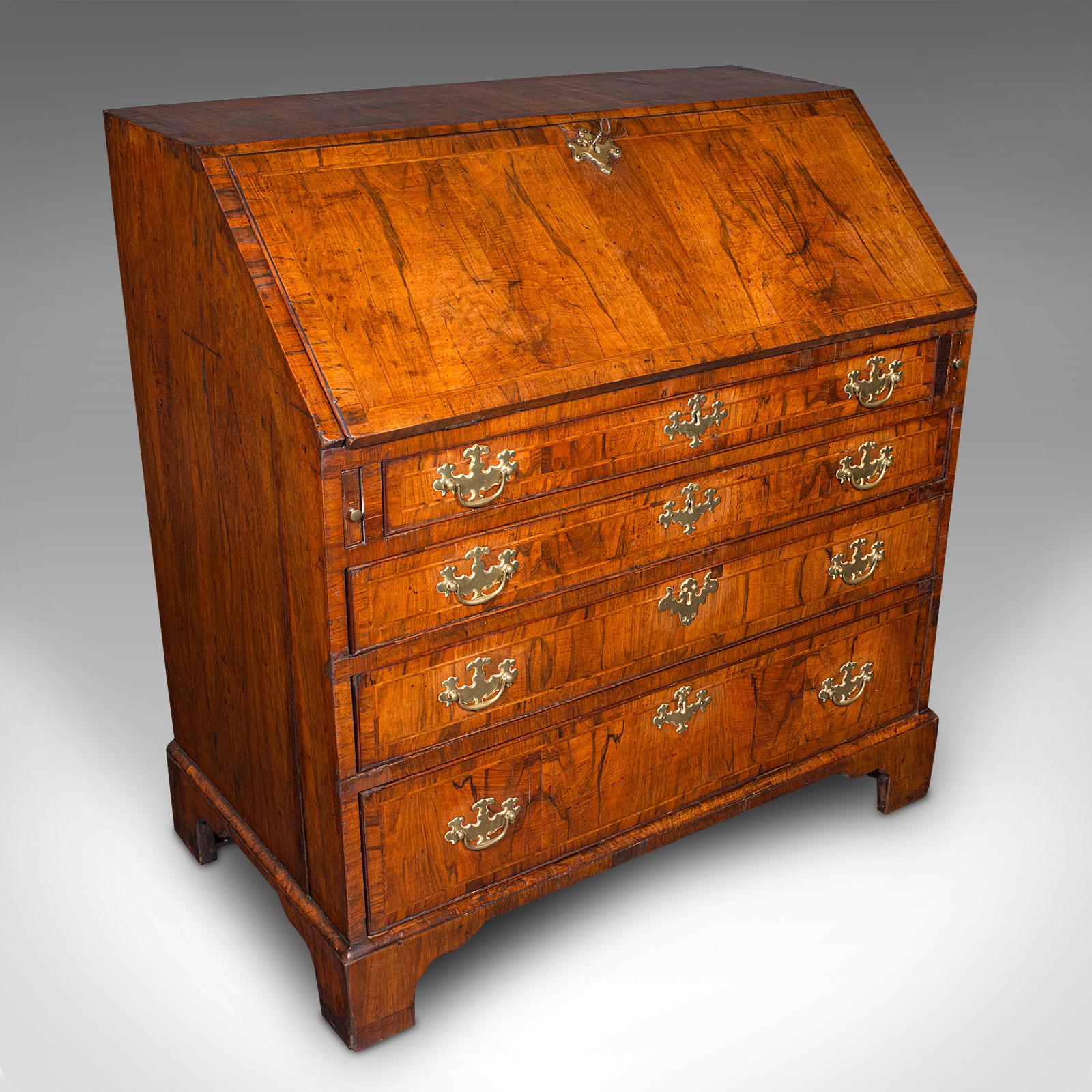 
This is an antique gentleman's bureau. A fine English, walnut writing desk or secretaire, dating to the Georgian period, circa 1760.

Wonderful Georgian example, with a delightful visual appearance
Displays a desirable aged patina and in good order