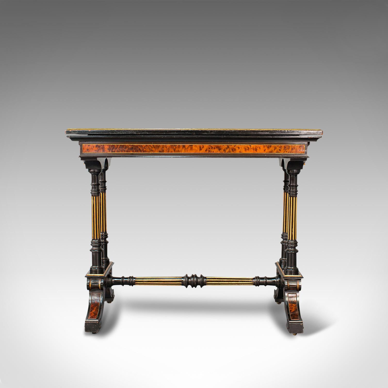 This is an antique gentleman's card table. A superior example of an English, ebonised and gilt gaming table by Gillow & Co of Lancaster, presented in wonderful condition, dating to the Aesthetic period, circa 1875.

Highly covetable example of