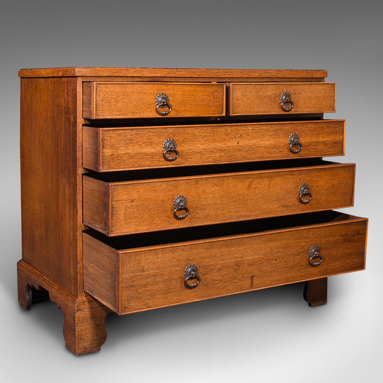 This is an antique gentleman's chest of drawers. An English, oak tallboy of squat proportion, dating to the Georgian period and later, circa 1800.

Wonderfully figured and presenting fine colour
Displaying a desirable aged patina