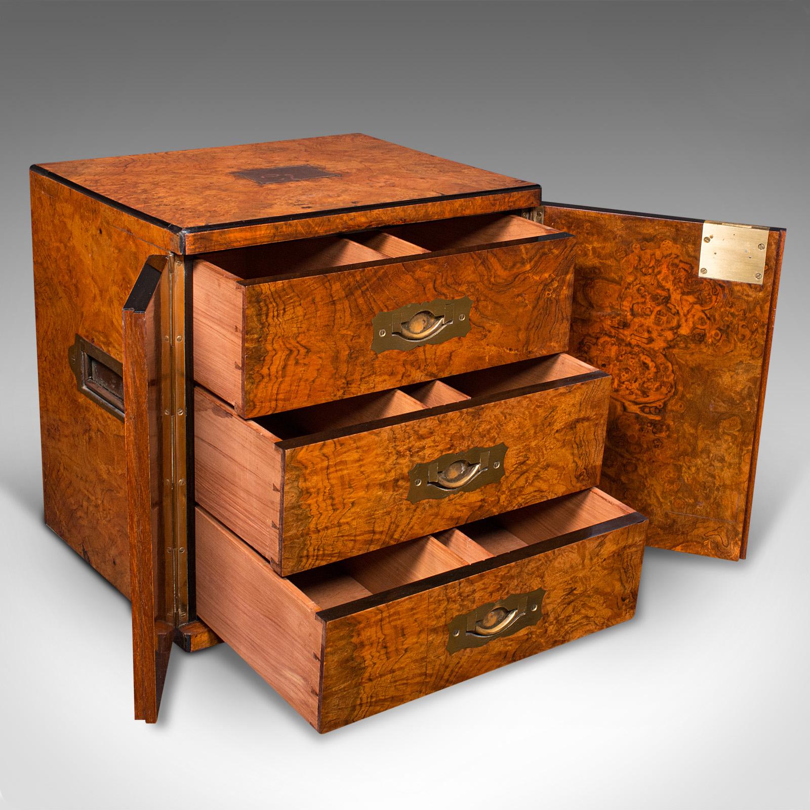 This is an antique gentleman's cigar humidor. An English, burr walnut and cedar campaign smoker's box with Bramah lock, dating to the Regency period, circa 1820.

Exquisite figuring and craftsmanship elevate this fine humidor
Displaying a