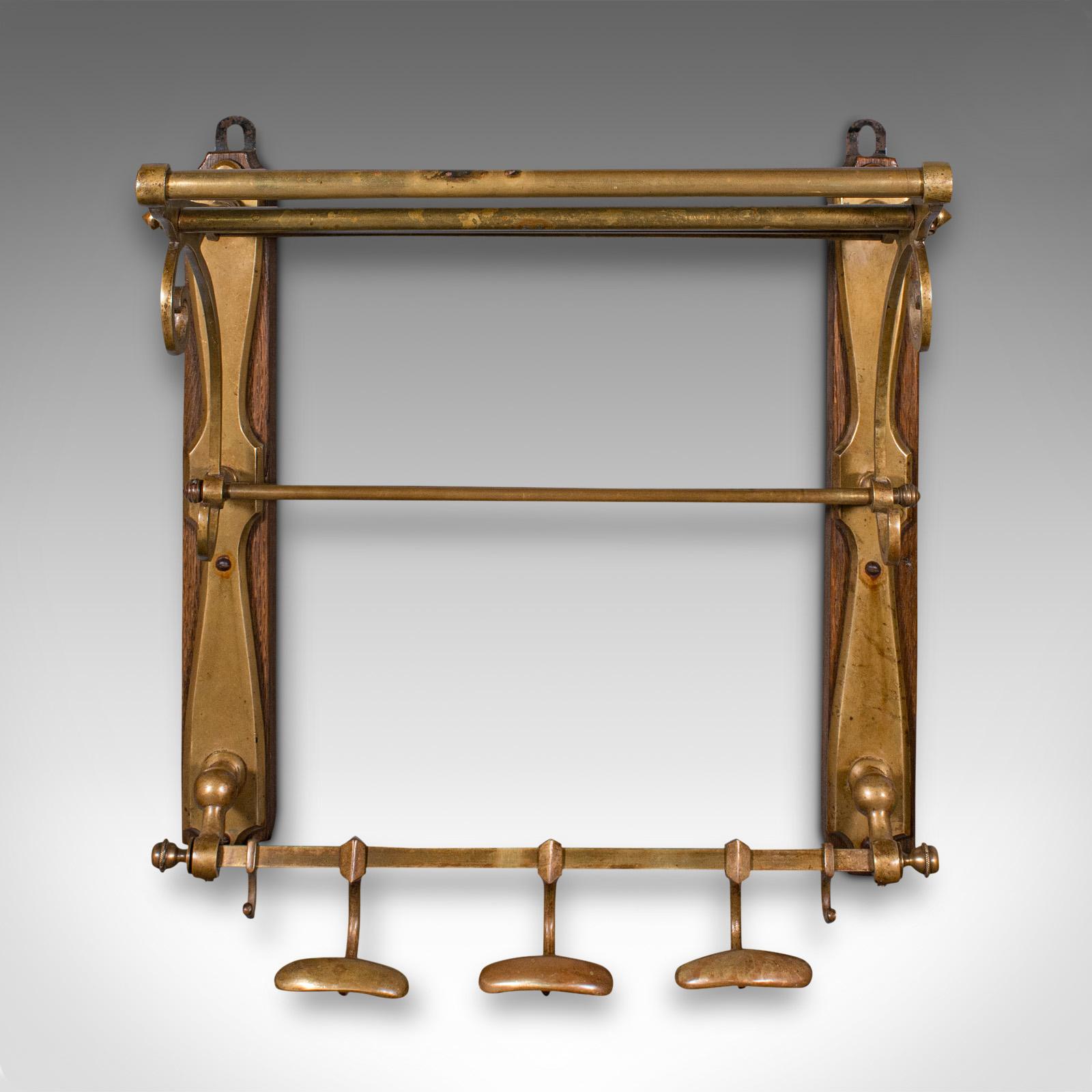 This is an antique gentleman's club valet. A French, brass and oak reception hall rack, dating to the Victorian period, circa 1870.

Graced with elegant forms and quality fittings, perfect for a grand entrance
Displays a desirable aged patina and in