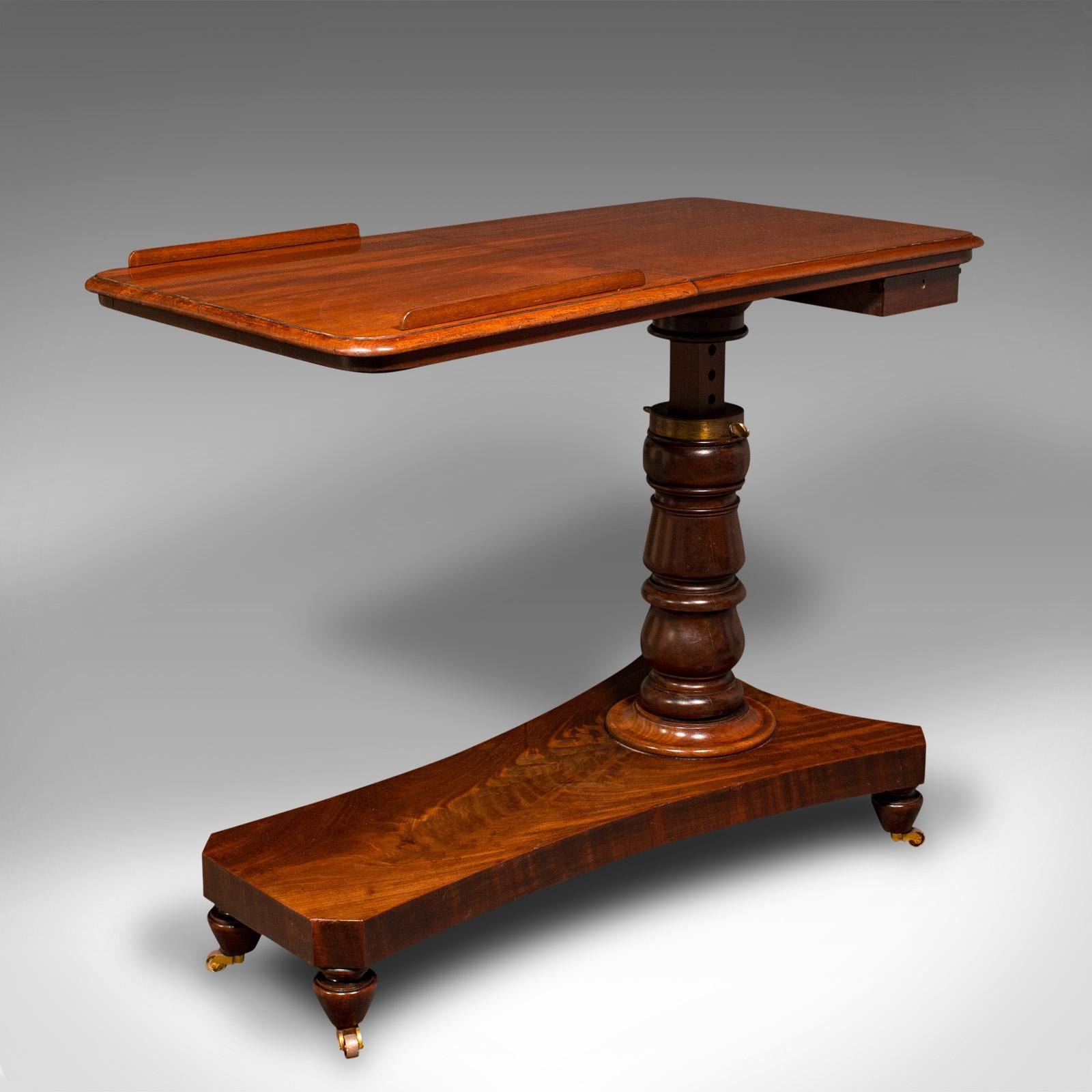 This is an antique gentleman's reading table. An English, mahogany adjustable cantilever writing desk, dating to the Victorian period, circa 1870.

Exceptional versatility to this attractive, well-crafted table
Displays a desirable aged patina