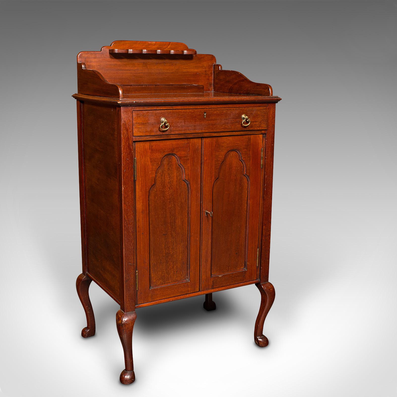 This is an antique gentleman's side cabinet. An English, mahogany club lounge stand, dating to the Edwardian period, circa 1910.

Well appointed and attractive stand, ideal for relaxing beside a warm fire
Displays a desirable aged patina and in good