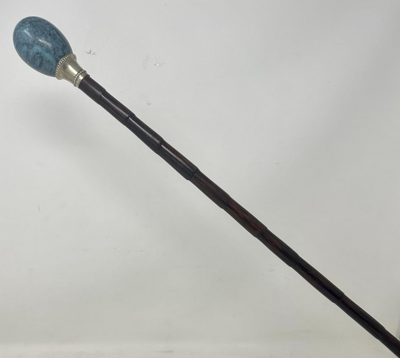 Superb rare polished well figured banded partridge wood sword stick of outstanding quality, enclosing its original square tapering polished steel thin blade, late 19th century, early 20th century, possibly of Continental origin. 

The egg-shaped