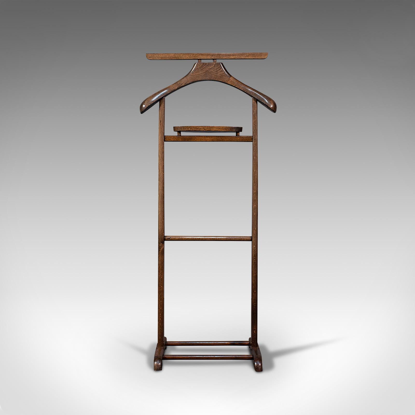 This is an antique gentleman's valet. An English, beech bedroom rack or nightstand, dating to the Edwardian period, circa 1910.

Elegant practicality for the master bedroom
Displaying a desirable aged patina
Select beech awash with fine grain