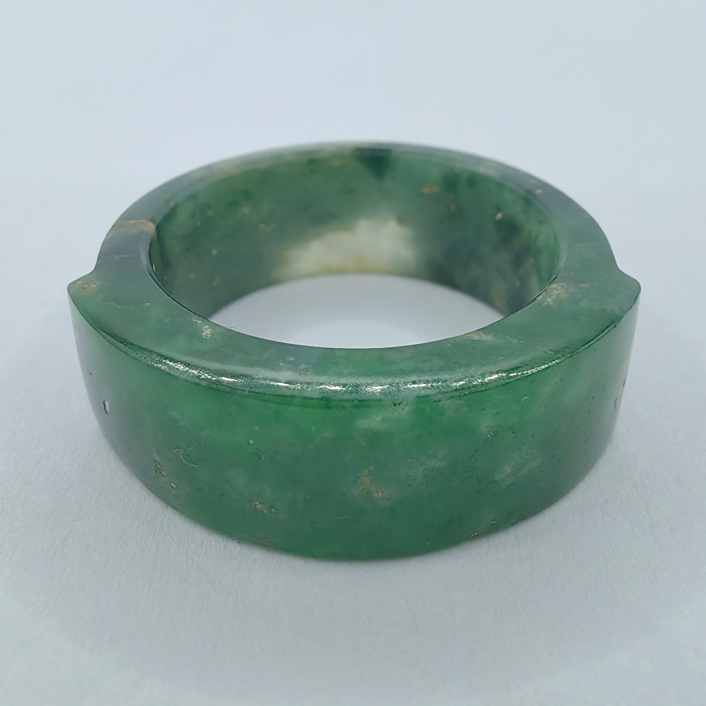 Introducing our Antique Genuine Burmese Imperial Green Jadeite Jade Statement Ring, crafted circa 1880 during the late Qing Dynasty. This remarkable piece not only showcases the timeless beauty of jadeite jade but also carries the historical