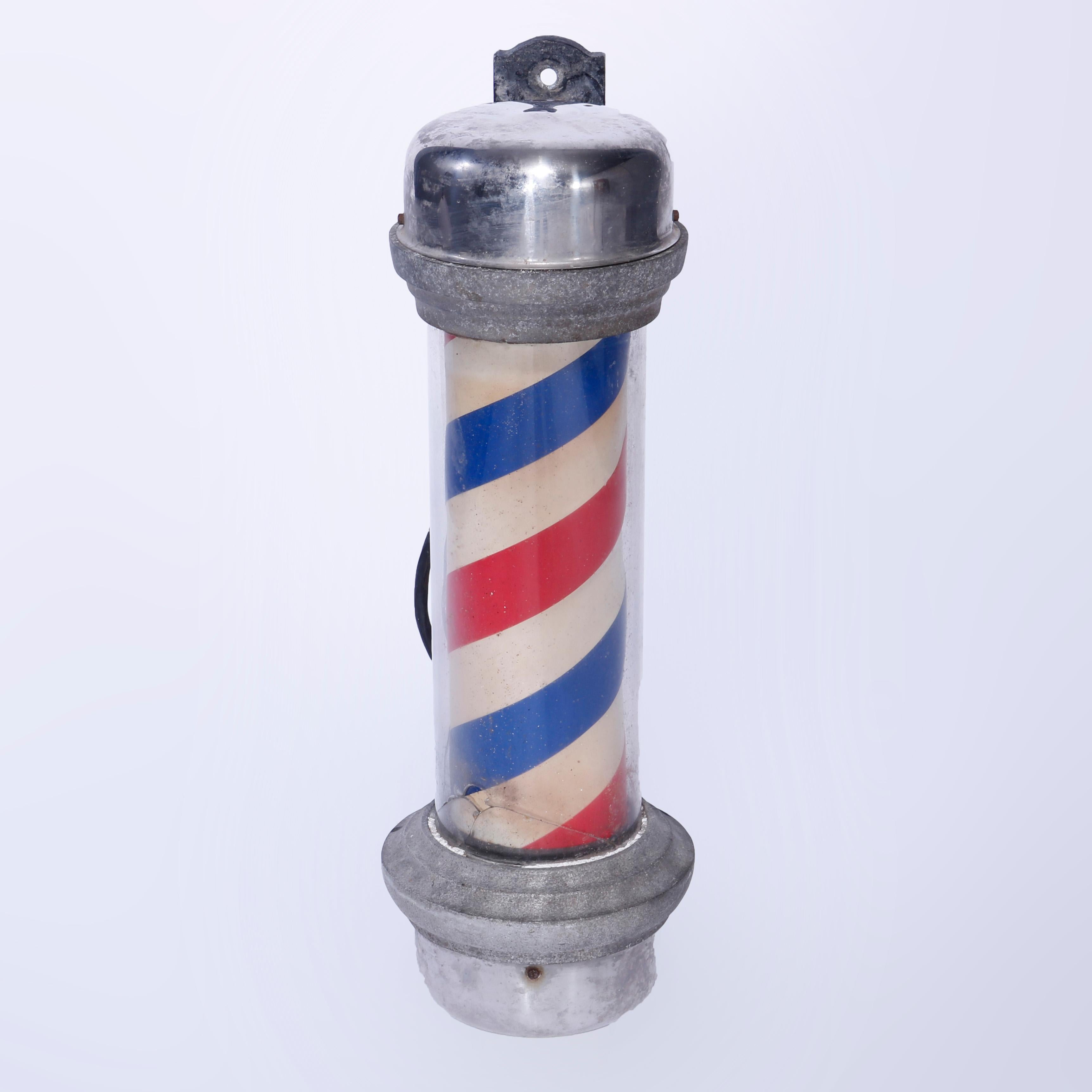 An antique barber shop pole by William Marvy & Co. St Paul MN offers the traditional red, white and blue twist striped pole encased in glass with chrome and cast iron wall bracket, maker label as photographed, circa 1930’s, 

Measures - 27.25'' H