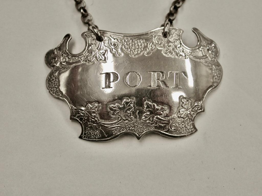 Antique Geo 11 Silver Escutcheon Shaped Port Label Sandylands Drinkwater C.1745
This is amongst the earliest silver wine labels you can find.
It has wonderful flat chasing which is typical of this period in time.
This is the second makers mark of