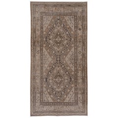 Tapis géométrique antique Khotan, tons terreux, vers les années 1930