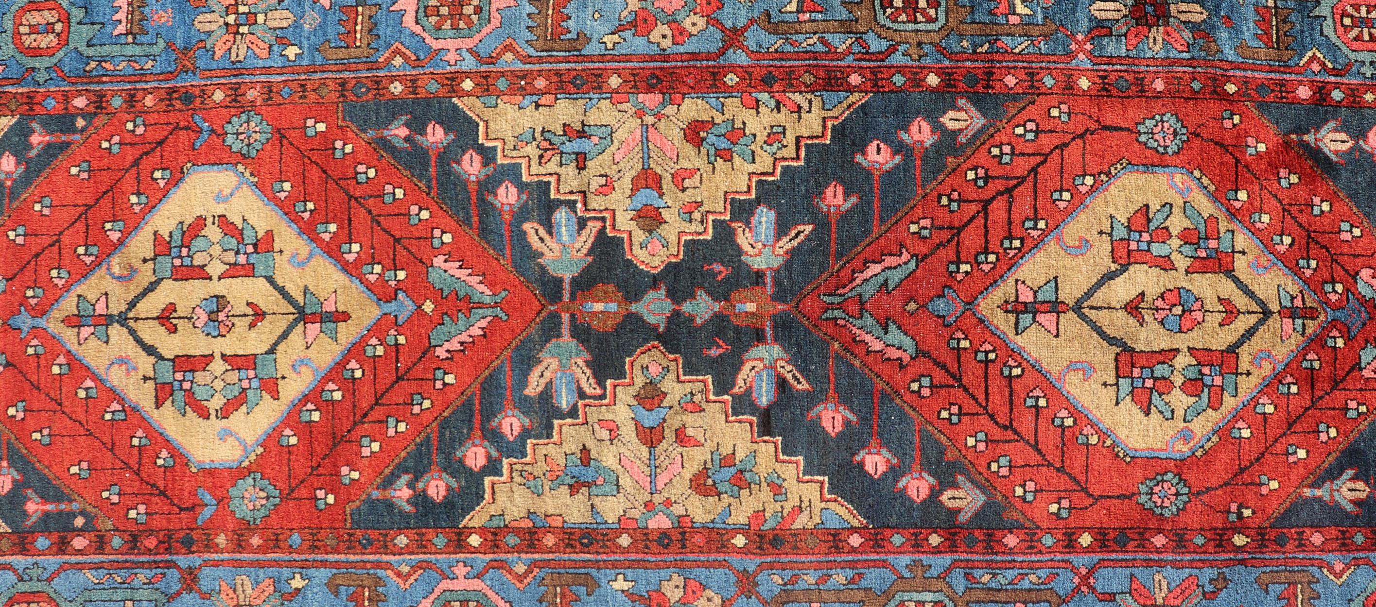 Very long antique Persian Heriz runner with geometric medallion design in red, blue and colorful tones, Keivan Woven Arts Atlanta / rug EMB-9571-P13889, country of origin / type: Iran / Heriz, circa 1920

Measures: 3 x 14'9.