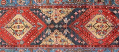 Antique Geometric Persian Long Heriz Runner in Red, Blue, Yellow, and Tan