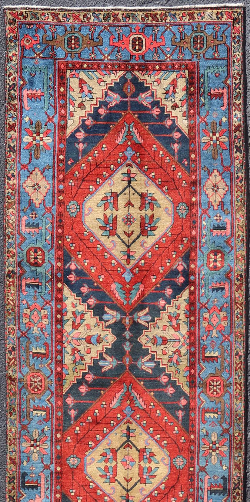Hand-Knotted Antique Geometric Persian Long Heriz Runner in Red, Blue, Yellow, and Tan For Sale