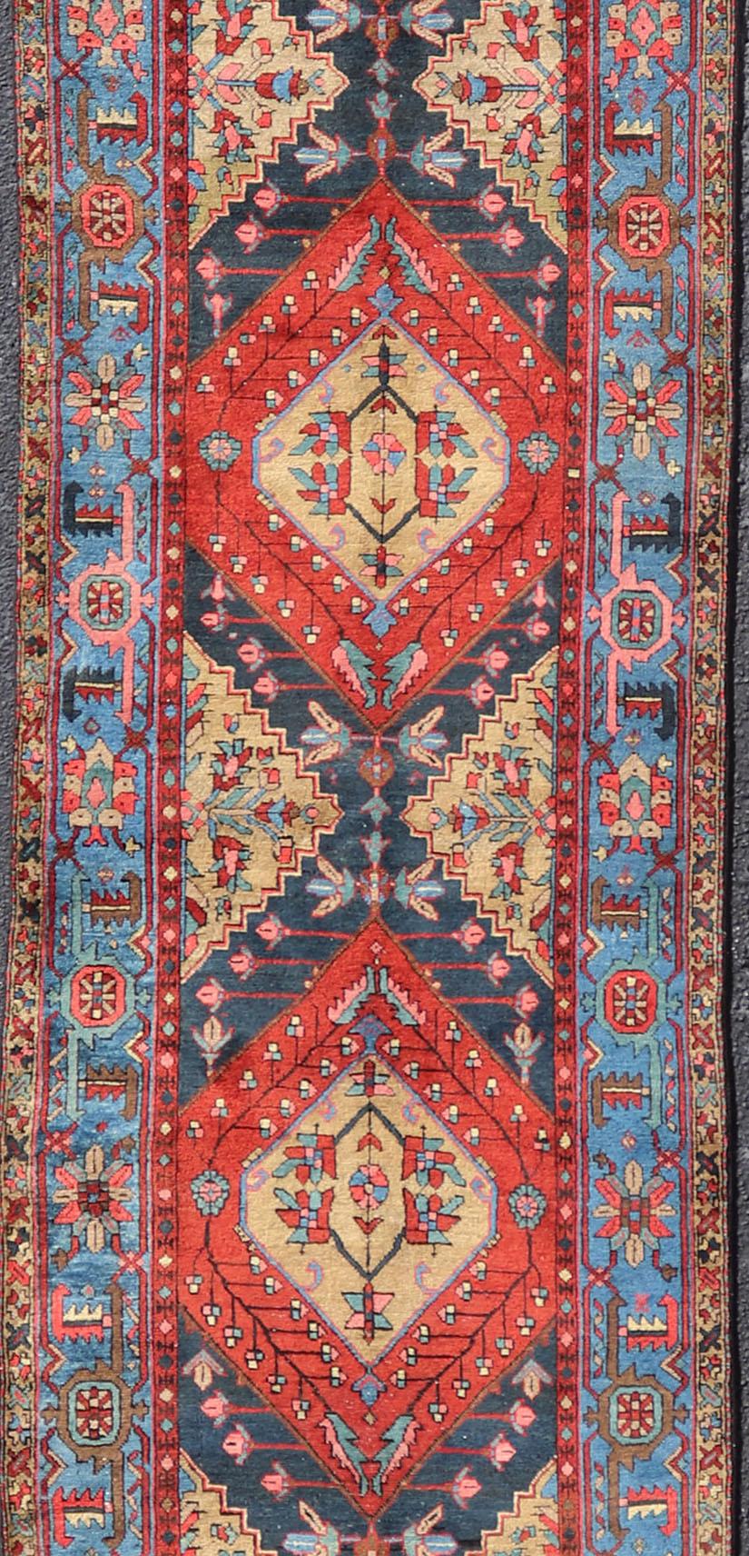 Antique Geometric Persian Long Heriz Runner in Red, Blue, Yellow, and Tan In Good Condition For Sale In Atlanta, GA