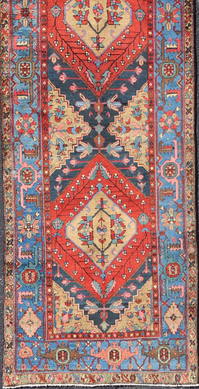 20th Century Antique Geometric Persian Long Heriz Runner in Red, Blue, Yellow, and Tan For Sale