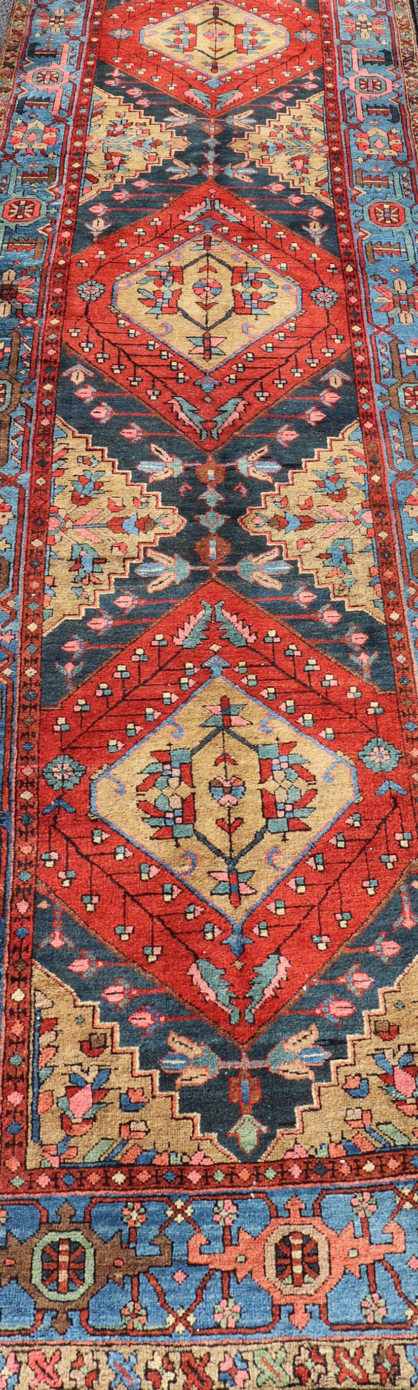 Antique Geometric Persian Long Heriz Runner in Red, Blue, Yellow, and Tan For Sale 1