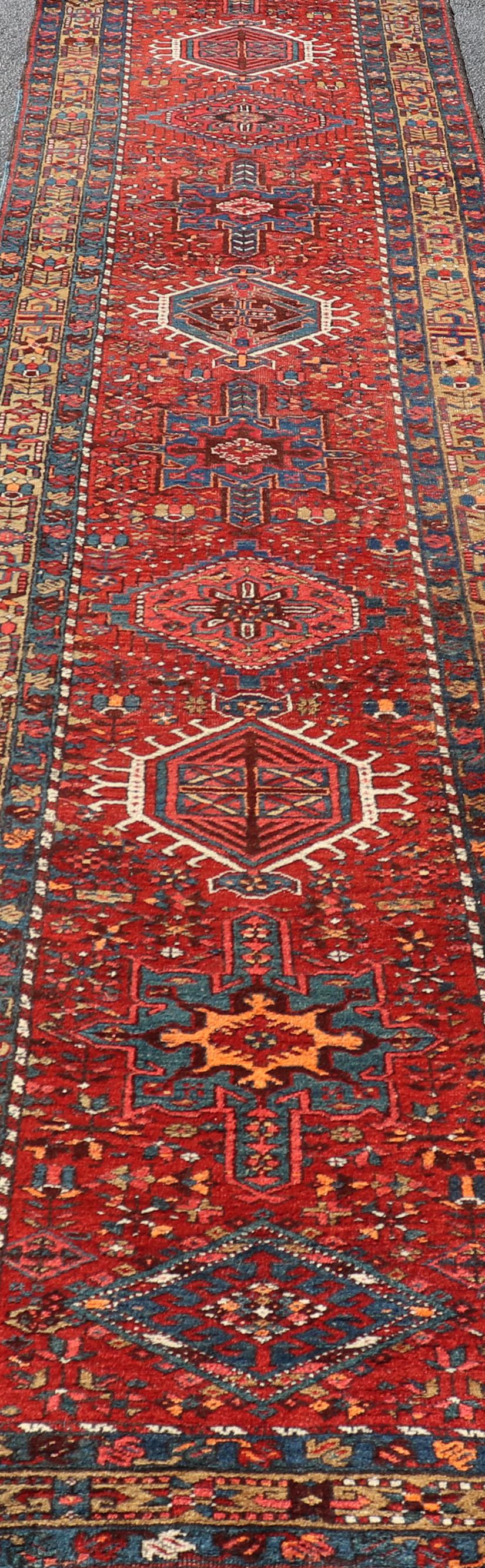 Wool Antique Geometric Persian Long Heriz Runner in Red, Blue, Yellow, Teal, Orange For Sale