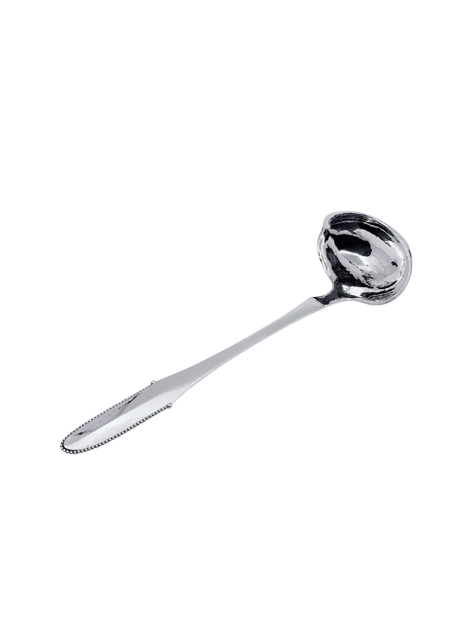 A very large Georg Jensen sterling silver punch/soup ladle, item #151 in the Beaded pattern, design #7 by Georg Jensen from 1916. This is the larger size punch/soup ladle in excellent condition, the hand hammered finish is still visible. Please