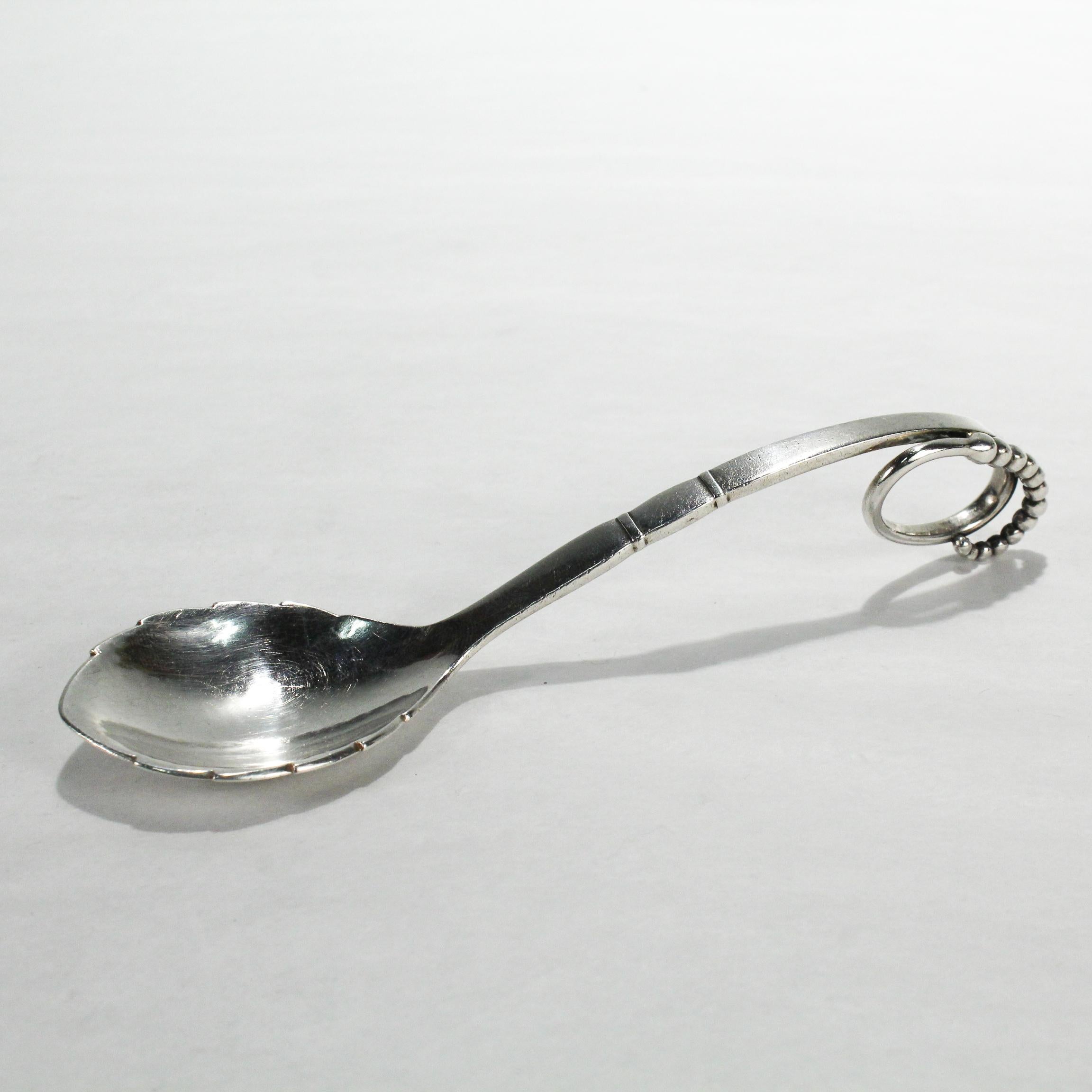 A fine vintage Georg Jensen sugar spoon.

In sterling silver.

Model no. Ornamental 41

Designed by Georg Jensen.

Simply a great sugar spoon! 

Date:
1933-1944

Overall Condition:
It is in overall good, as-pictured, used estate