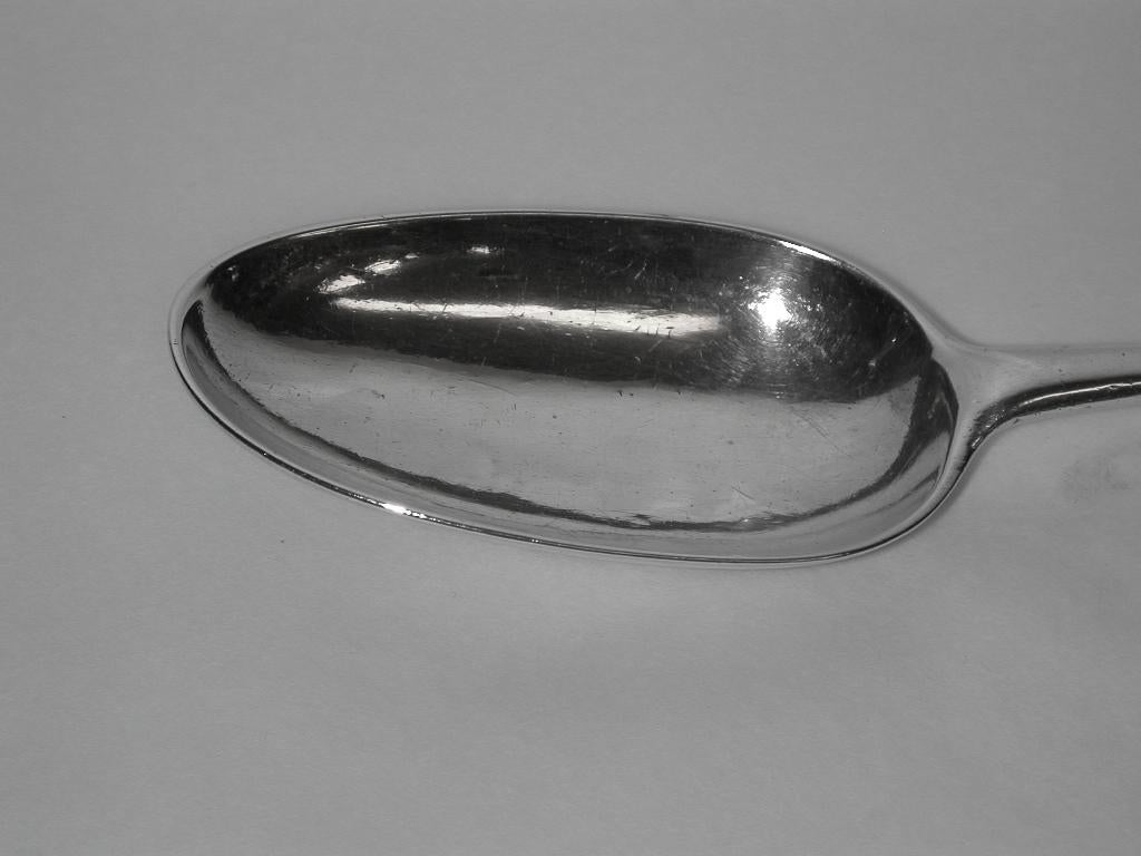 Lovely George 111 Silver basting or stuffing spoon made by John Locker of Dublin.
This spoon has a wonderful patina and the curved lip at the top of the handle,
is only found on Irish silver spoons of this era.