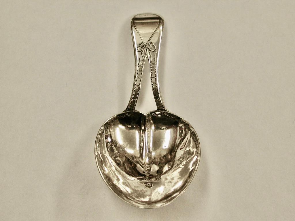 Antique George 111 silver bright cut tea Caddy spoon,John Linwood,1808
Assayed in Birmingham
This caddy spoon is beautifully formed with a heart shaped bowl and a divided
handle separately stamped with makers mark.