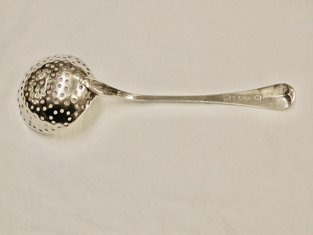 Antique George 111 Silver Sugar Sifter Spoon made in  Newcastle by  Langlands and Robertson dated circa 1790
Made in the old english pattern with a lovely original family crest.John Langlands was a Newcastle based silversmith. He was part of the