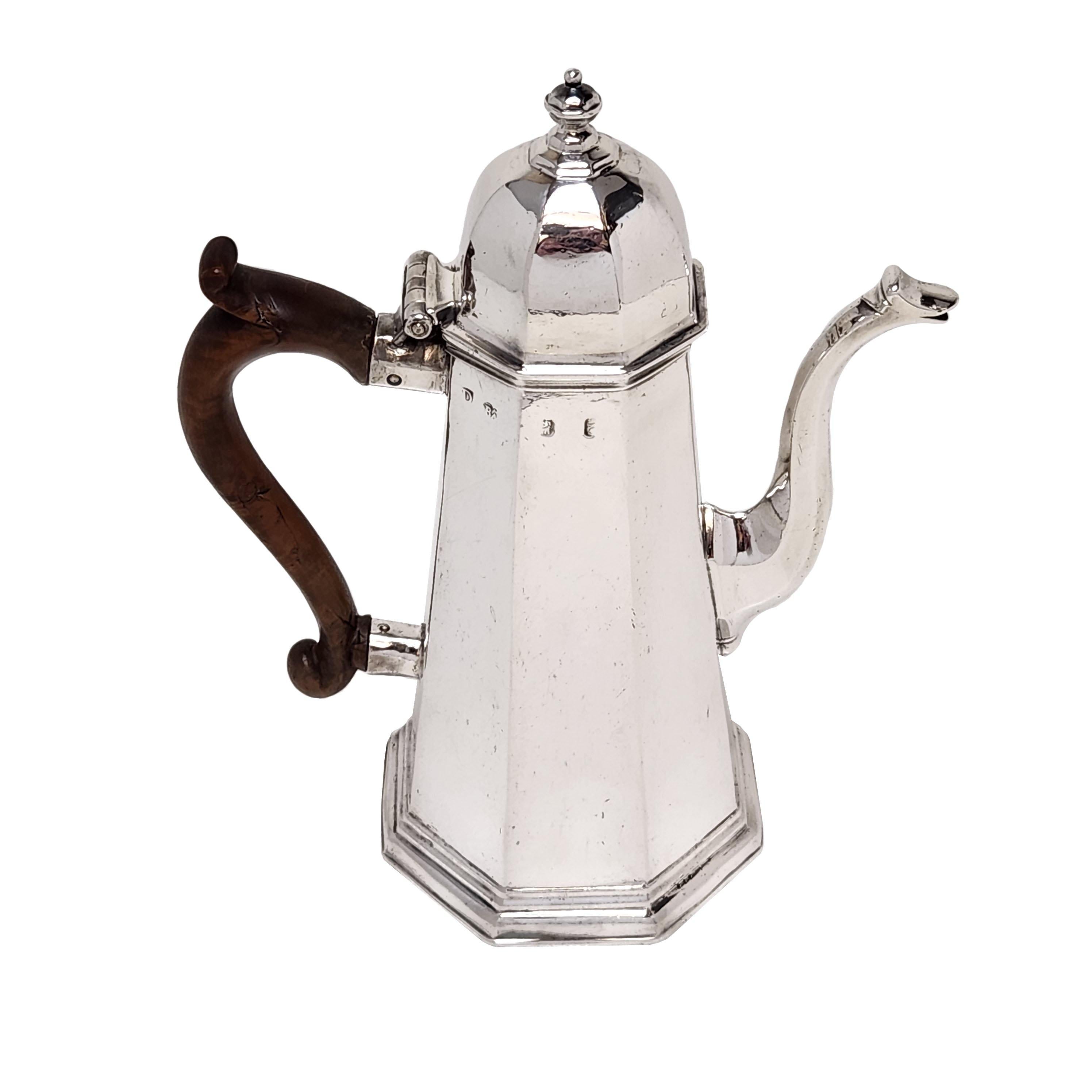 An elegant Antique George I Solid Silver Coffee Pot in a traditional Tapered Octagonal shape width an Octagonal Domed Lid. The early Georgian Coffee Pot has a wooden handle.

Made in London, England in 1719 by Richard Bayley.

Approx. Weight - 643g