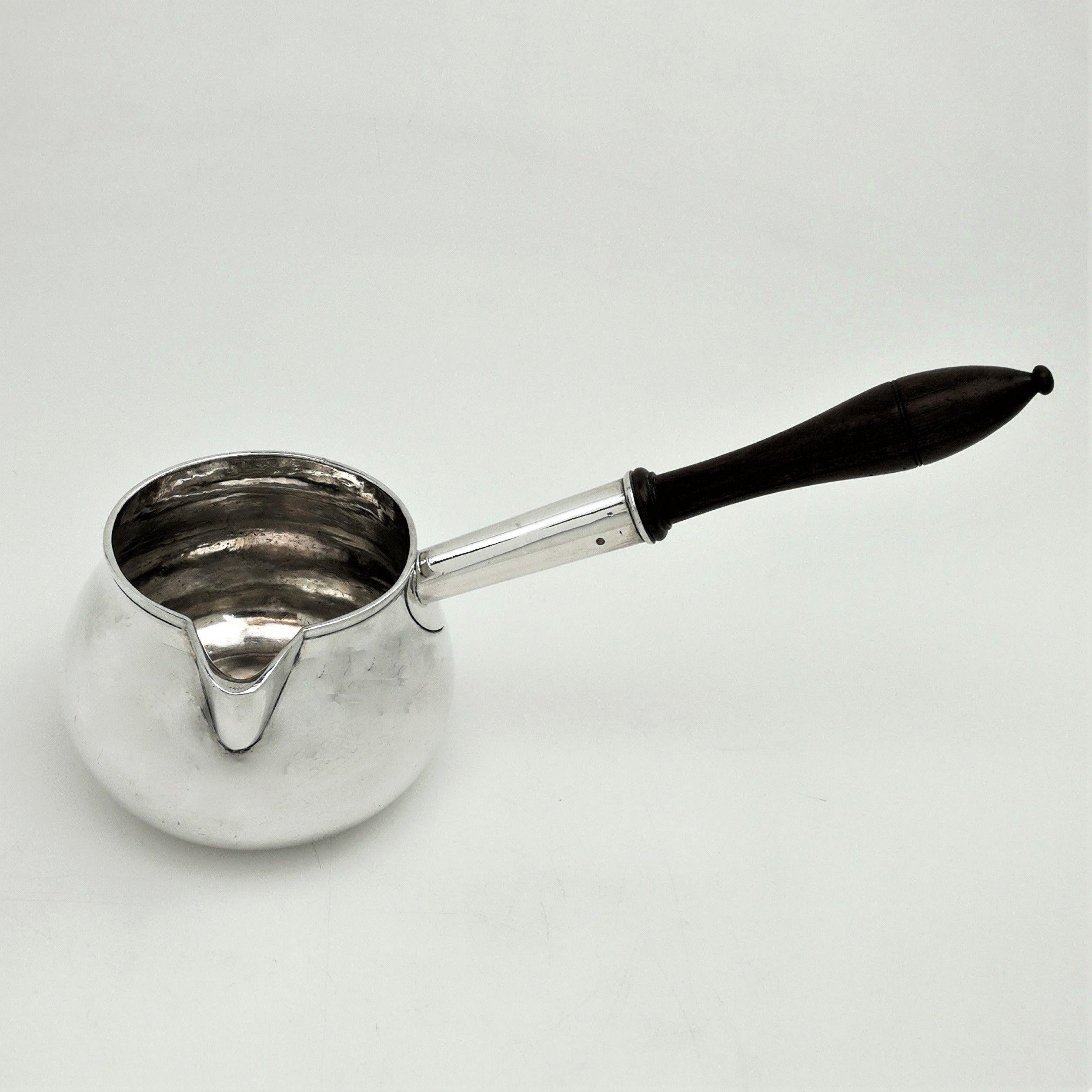 An elegant Antique George I solid silver Brandy Warming Pan with a plain baluster shape and a sturdy wooden handle. This Brandy Warmer is of particularly substantial size.
 
 Made in London in 1725 by William Spackman.
 
 Approx. Weight - 600g
