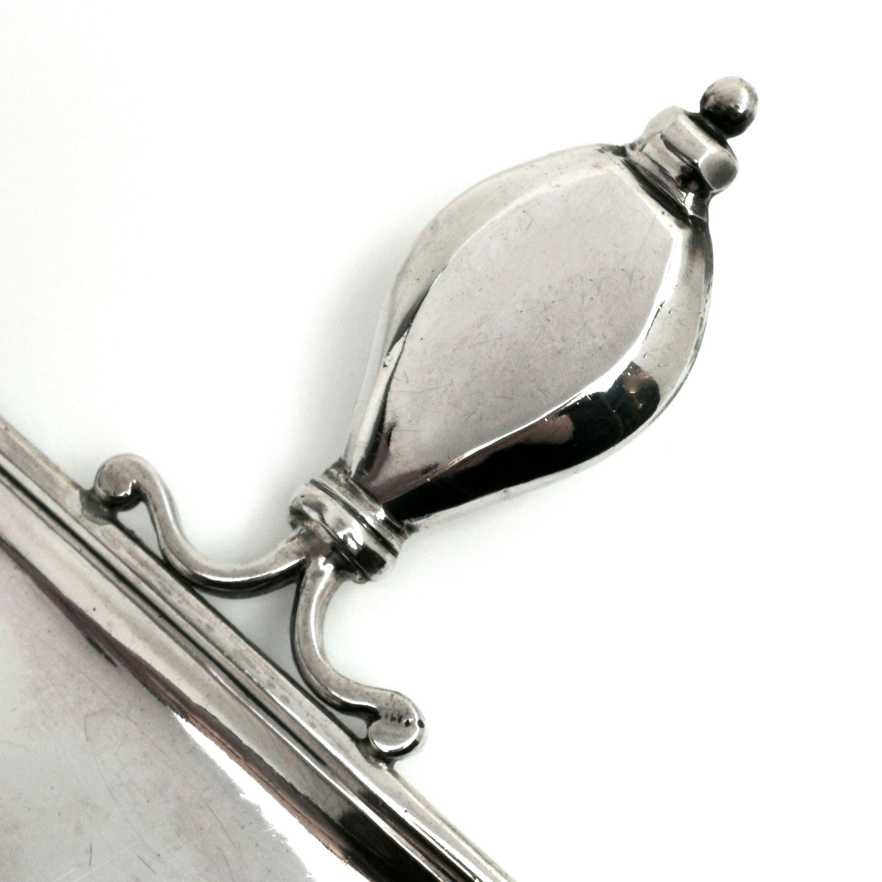 A lovely early Georgian George I solid silver spoon handled Snuffer Tray. The Tray has an elongated octagonal shape with a substantial spoon handle and stands on four circular feet. Perfect for Snuffers but also ideal for pens on a desk. 
 
 Made
