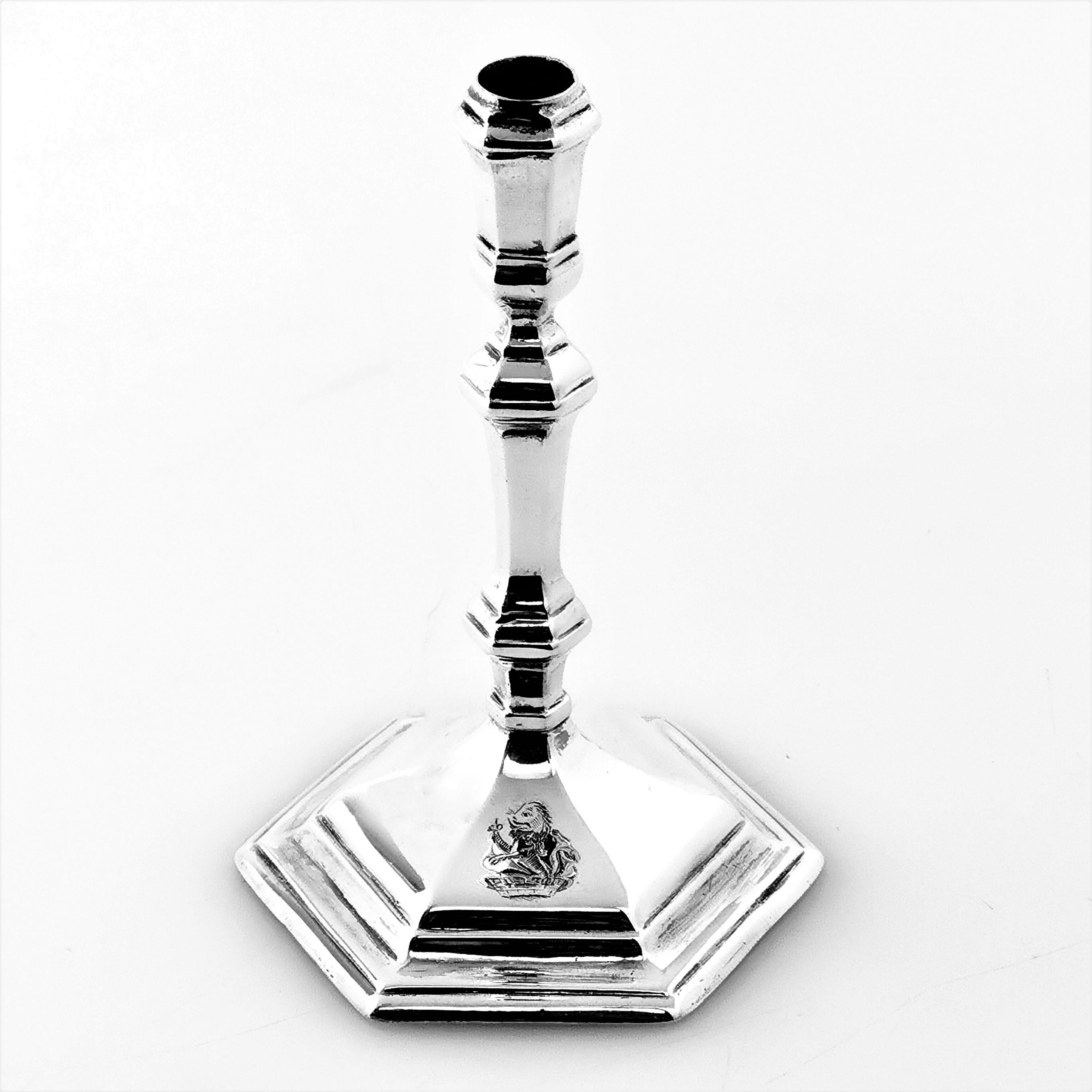 A classic Antique George I solid Britannia Silver Taper Stick with a hexagonal base. The Candlestick has a knopped column and features a small engraved crest on one panel. The Taper Stick has the initials CB over MS engraved on the underside.

Made