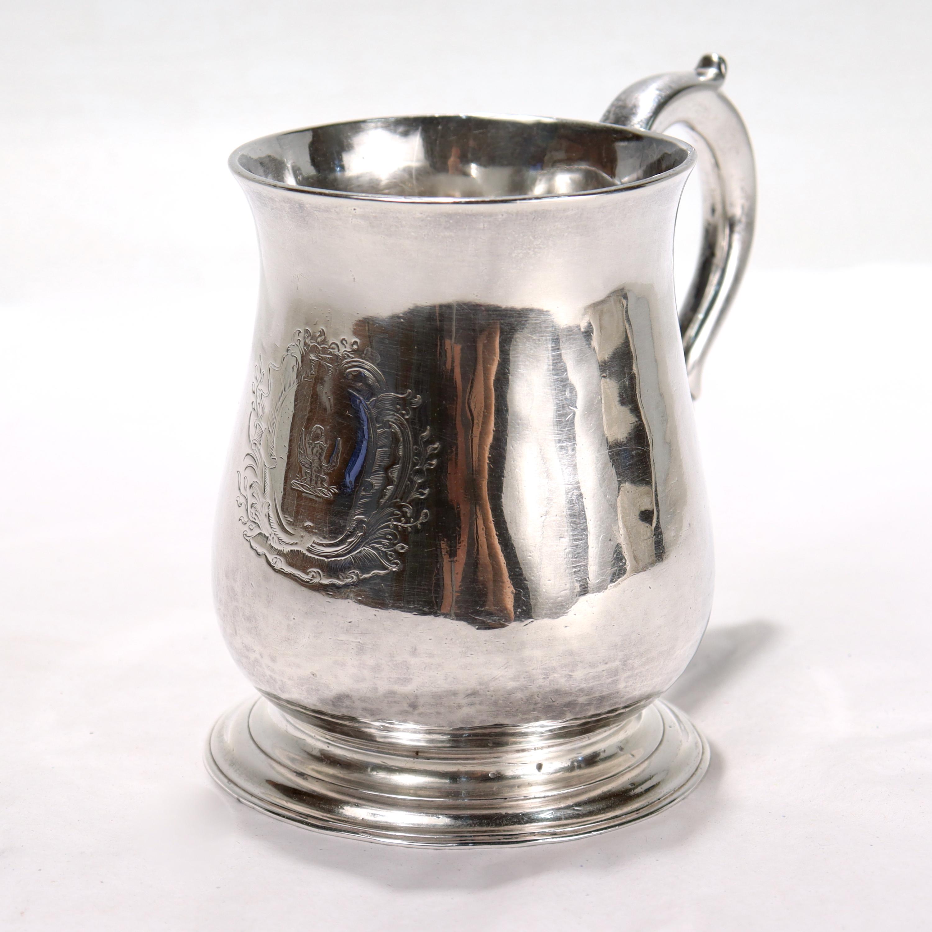 A wonderful George II baluster form sterling silver 1/2 pint mug.

By Richard Gurney & Thomas Cook in 1733.

With an engraved family crest to the front & the applied cast double scroll handle to the reverse. 

Simply a lovely English sterling silver