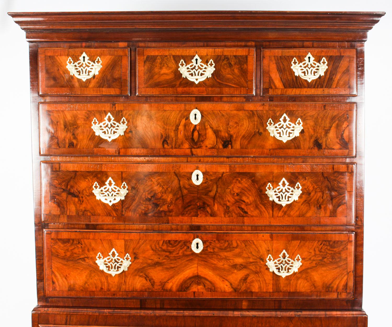This is a beautiful antique George II walnut and crossbanded chest on chest, circa 1740 in date.

It features a cavetto cornice above three small drawers with six capacious full width drawers below and these provide ample storage. 

The drawers