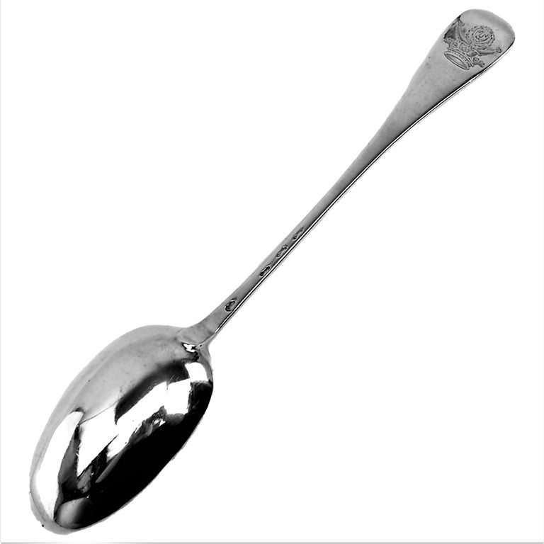 A large Antique early Georgian George II sterling Silver Hash Spoon / Basting Spoon / Serving Spoon in a Classic plain Hanoverian pattern. The Spoon has a crest engraved on the back of the handle.
 
Made in London in 1745 by John Wichehallis.
