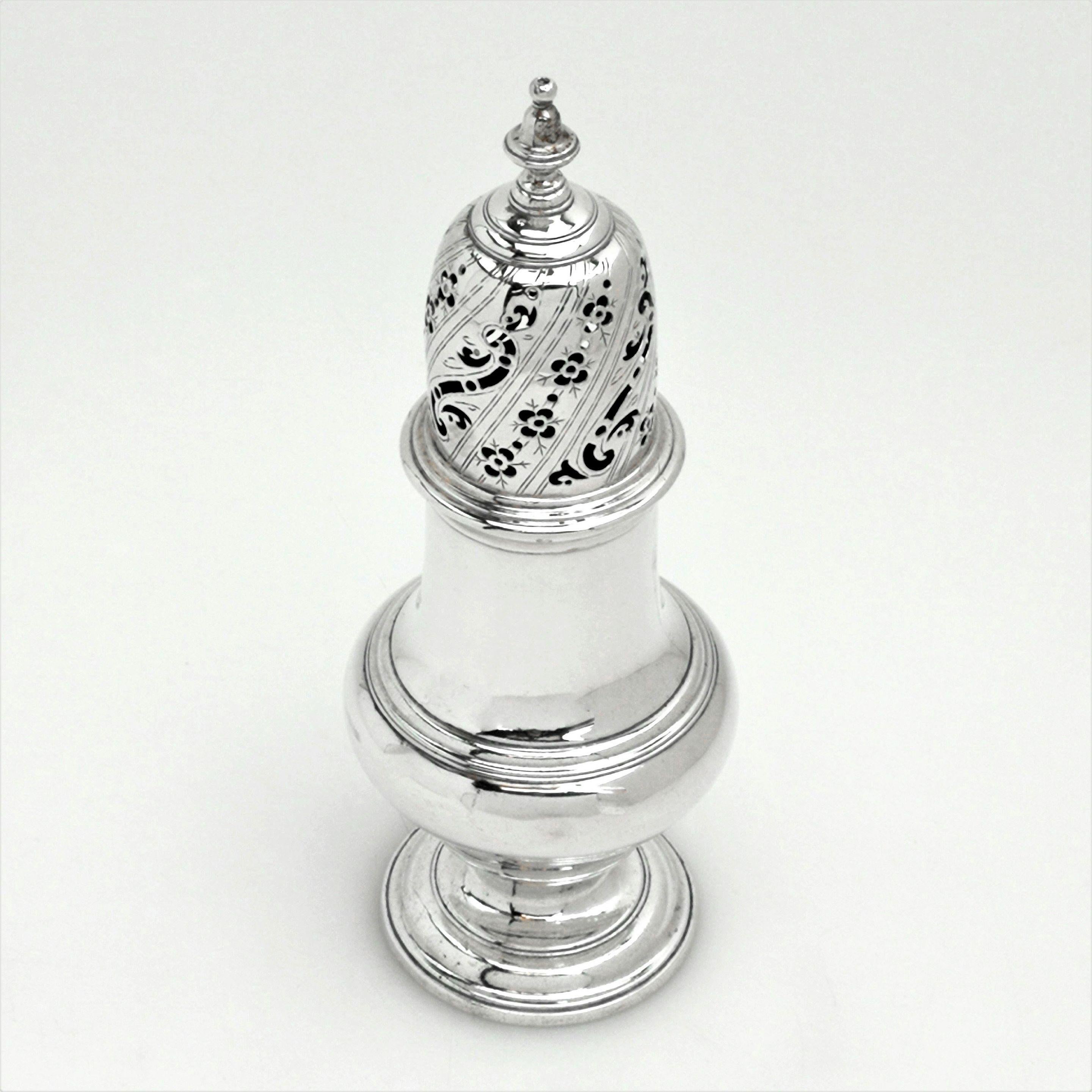 An antique George II Georgian silver sugar caster in a Classic baluster shape with a pierced push fit lid and standing on a spread foot. The caster has an armorial engraved on the side.
 
 Made in London in 1752 by John Delmestre.
 
Approx.