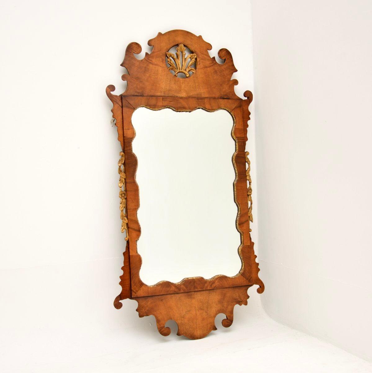 An absolutely stunning antique George II period walnut mirror. This was made in England, it has a carved date and location on the back reading: London, 1741.

It is of superb quality and is beautifully designed, with a sleek and refined look. The
