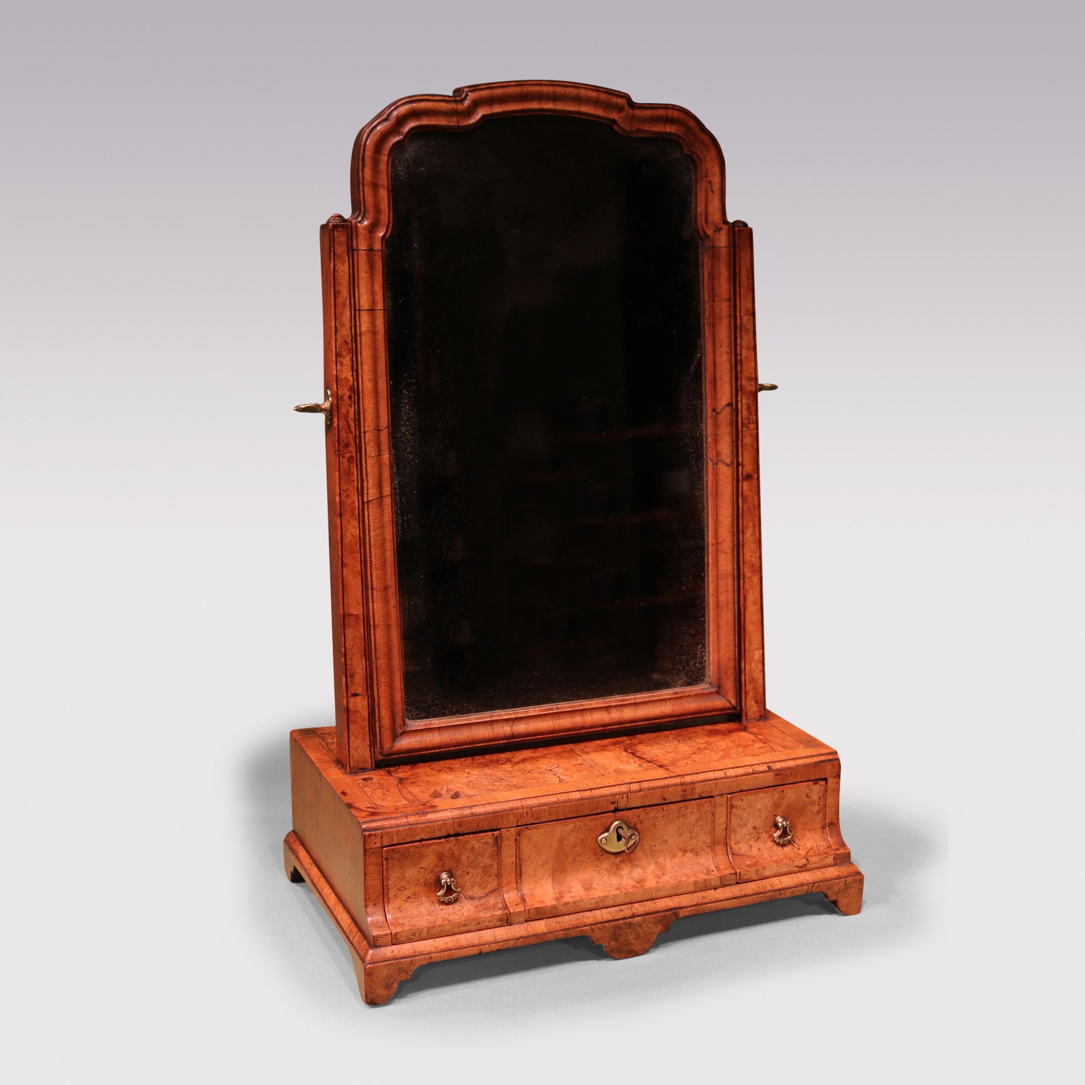 A rare George II period Toilet Mirror of attractive small proportions, having end-grain framed Mirror with shaped top, on lower section with cross-banded & herring bone inlaid top above 3 narrow herring bone inlaid concave drawers, supported on