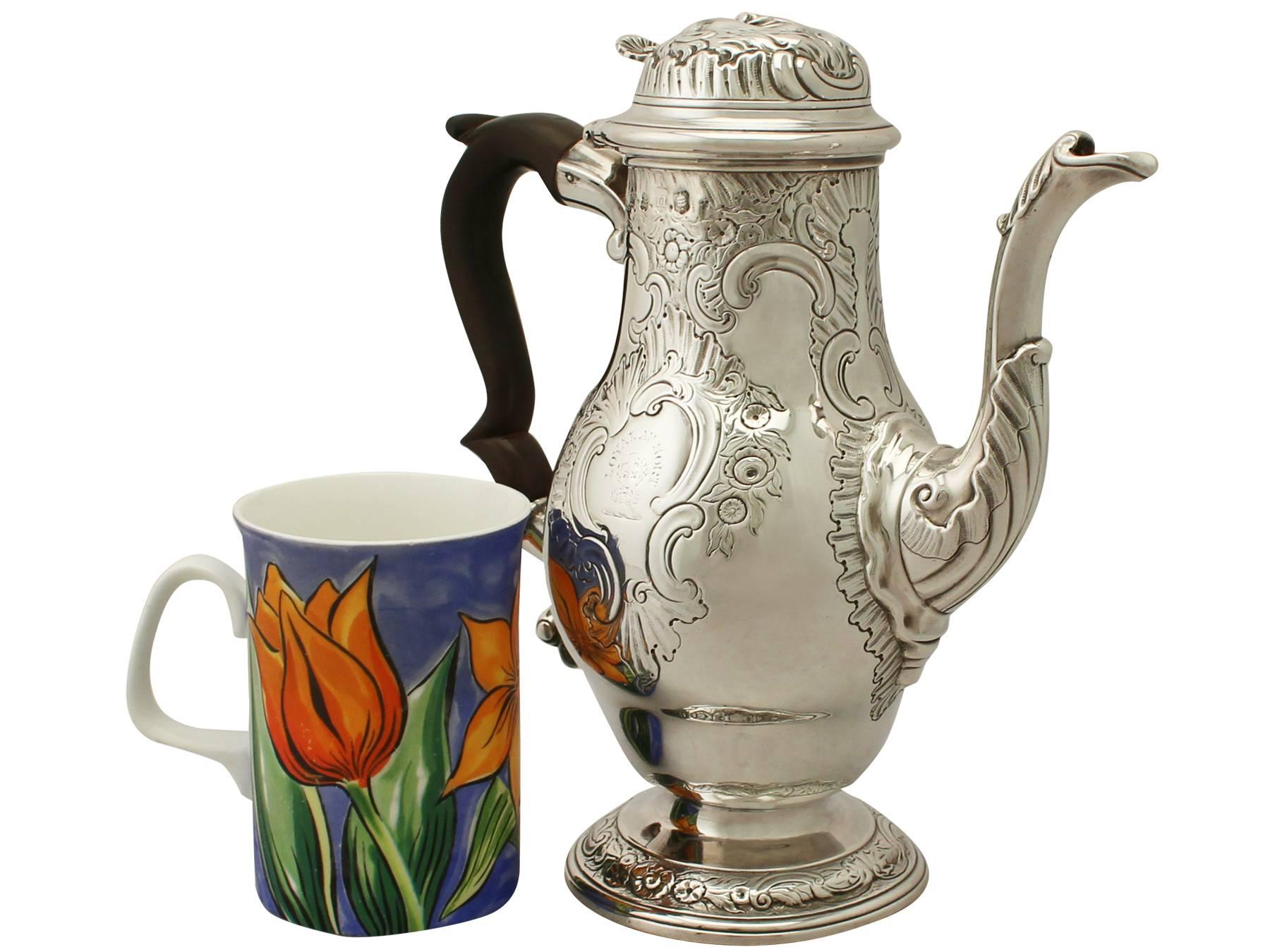 An exceptional, fine and impressive antique George II English sterling silver coffee pot, an addition to our Georgian silver teaware collection.

This exceptional antique Georgian sterling silver coffee pot has a baluster shaped form onto a