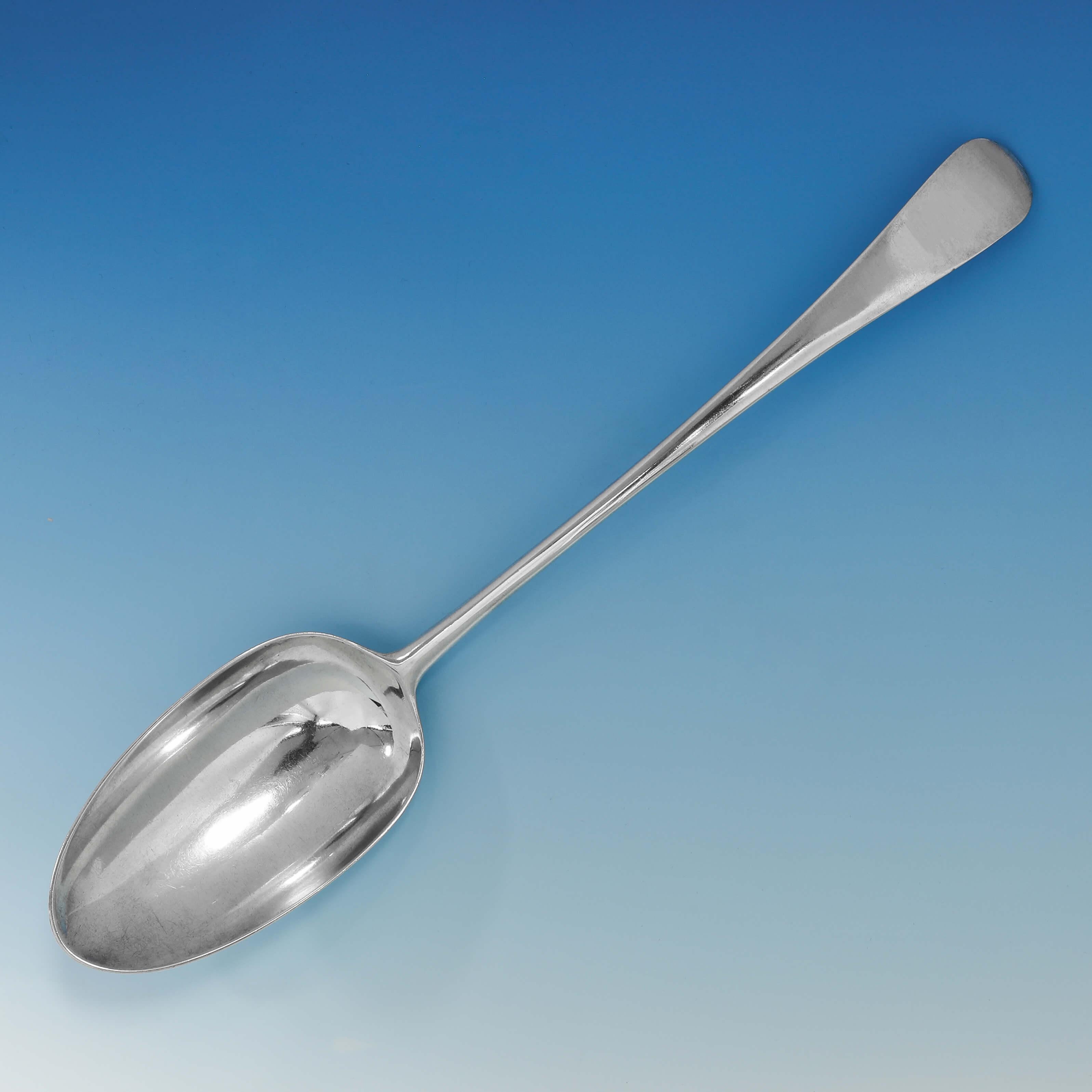 Hallmarked in London in 1757 by Henry Bailey, this very handsome, George II, antique sterling silver basting spoon, is in 'Old English' pattern, and has an unusual and very large bowl. The basting spoon measures 14