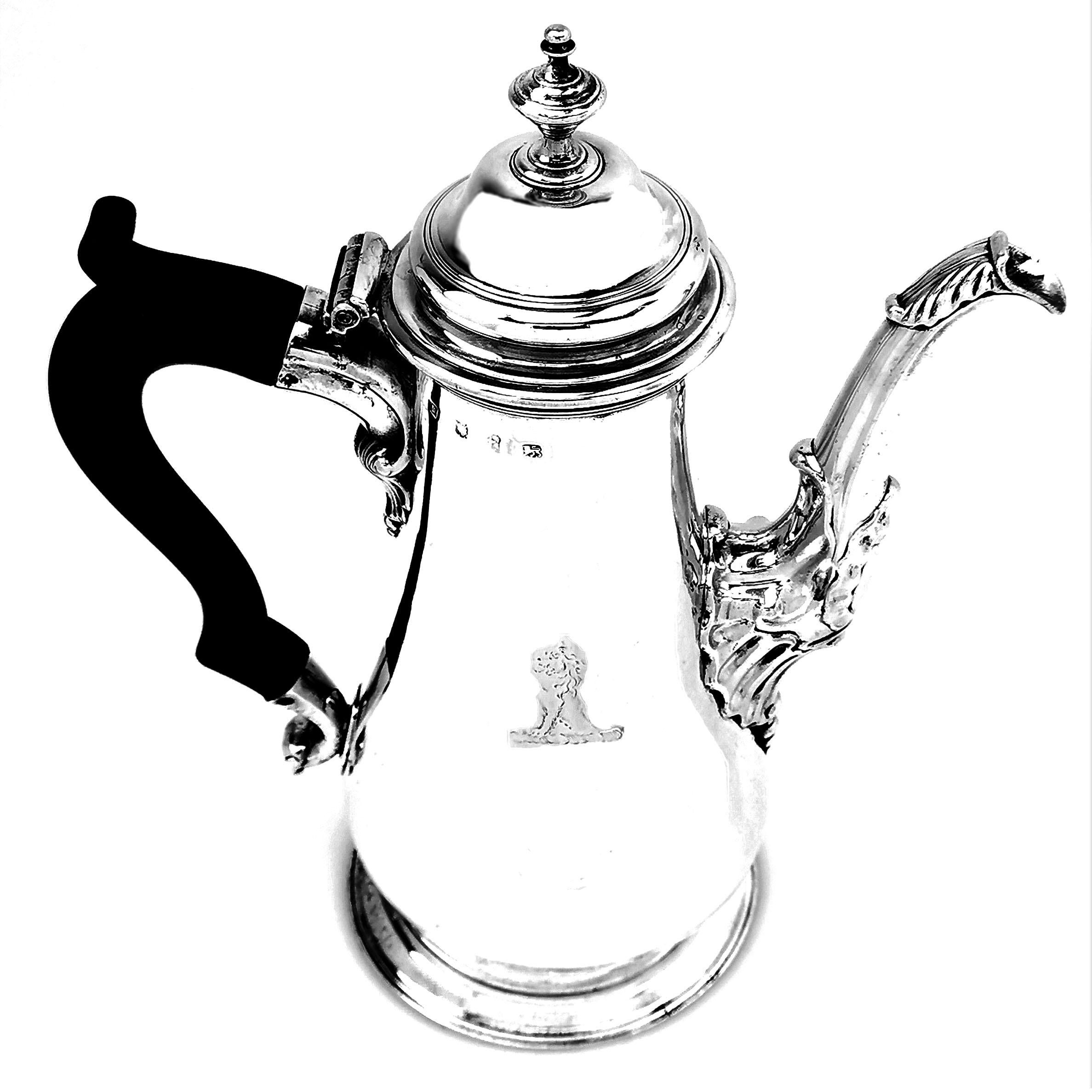 A magnificent Antique George II silver Coffee Pot in a traditional baluster shape, with unusually large proportions compared to the standard early Georgian coffee pots. This Georgian Coffee Pot has a large armorial engraved on one side and a small